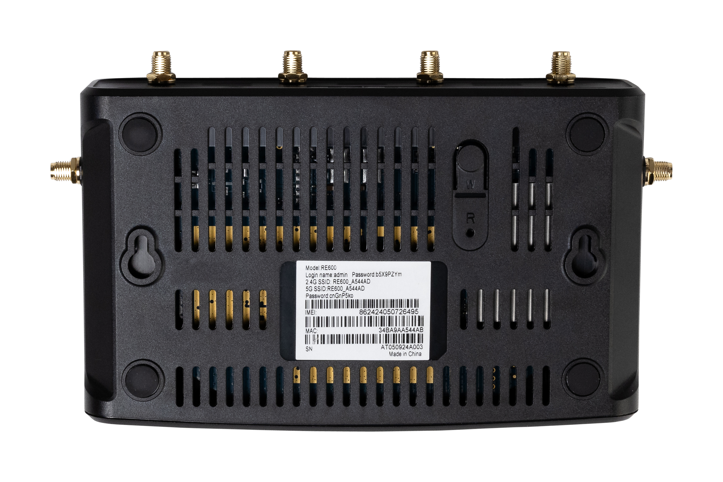 Rear view of a black electronic device with multiple gold connectors and vents, including labels with model number and specifications.