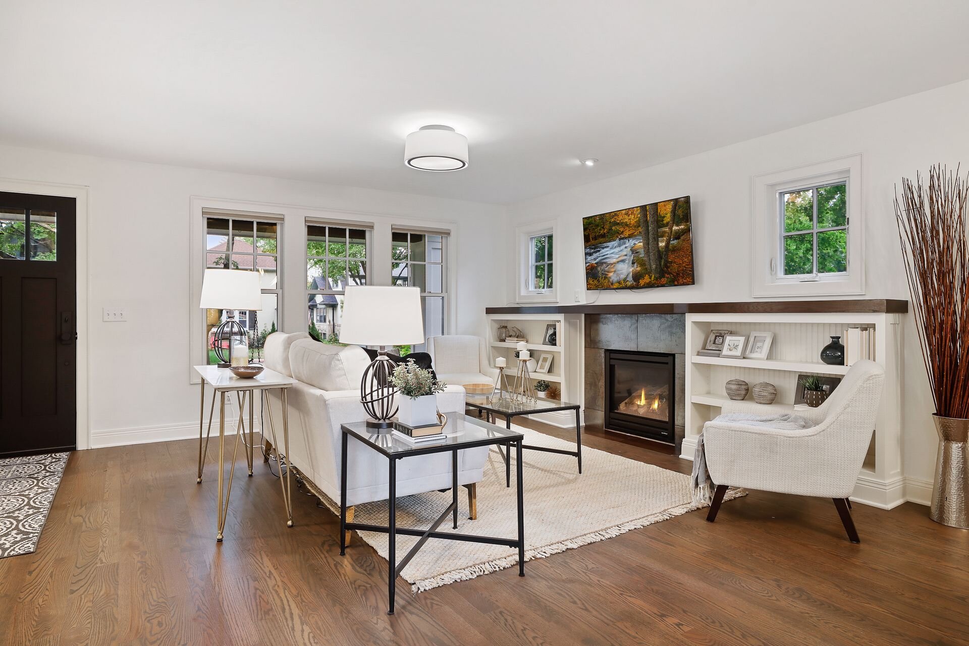 11 Main floor living room includes low-key built in shelve and a gase fireplace.jpg