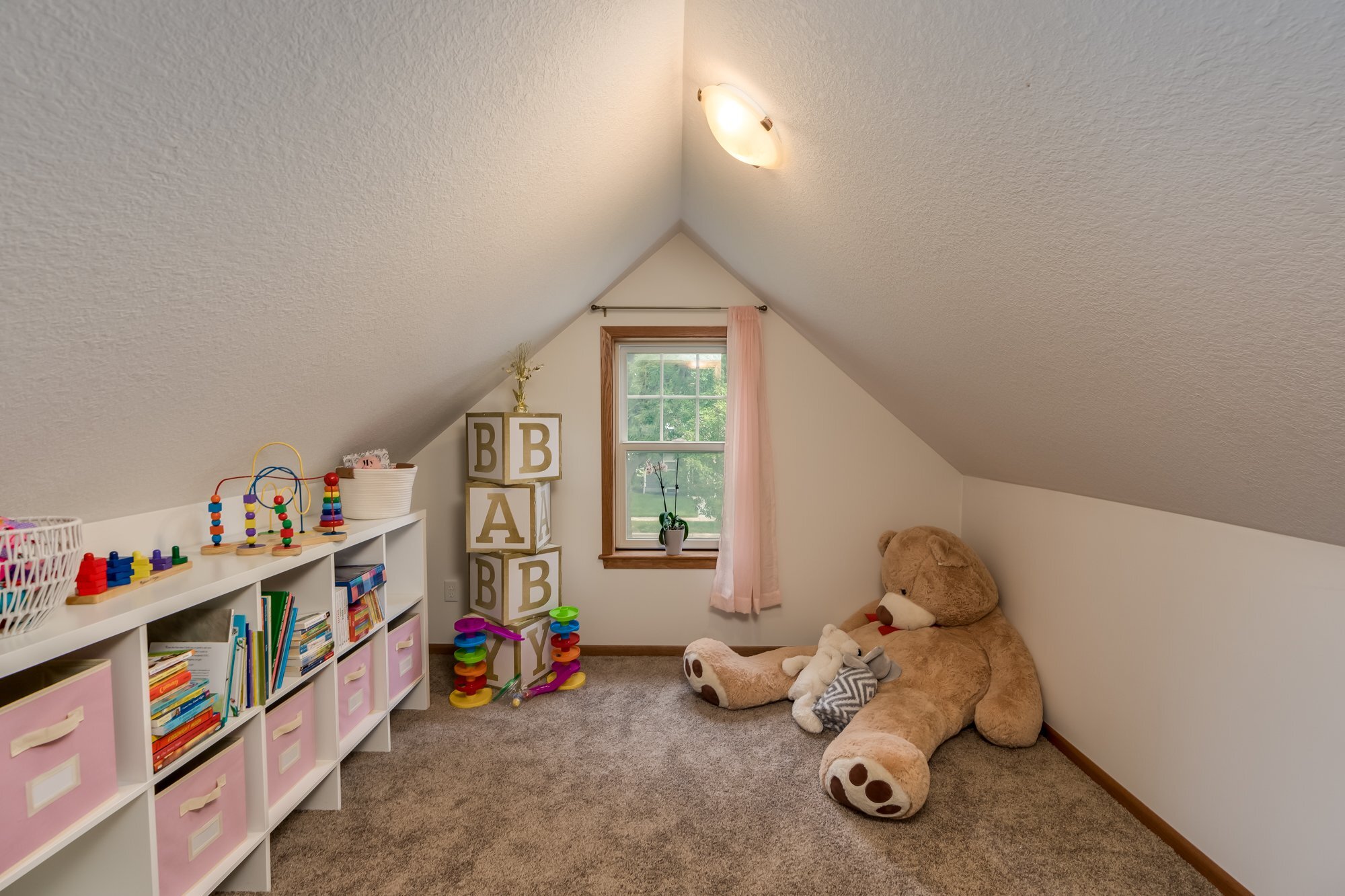 21. Bonus room: play room connected to upper level bedroom.jpg