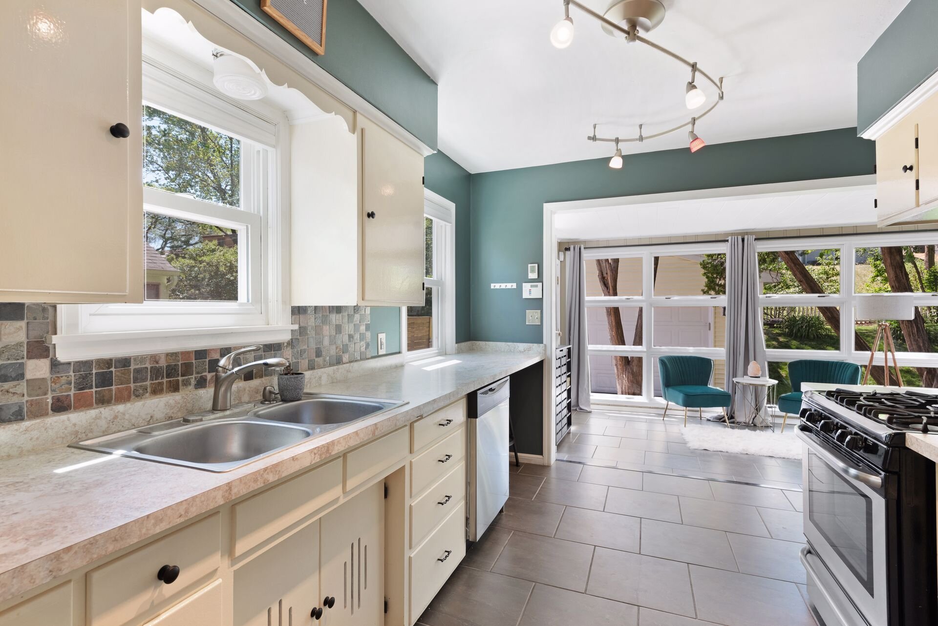 14. Spacious kitchen with attached sunroom.jpg