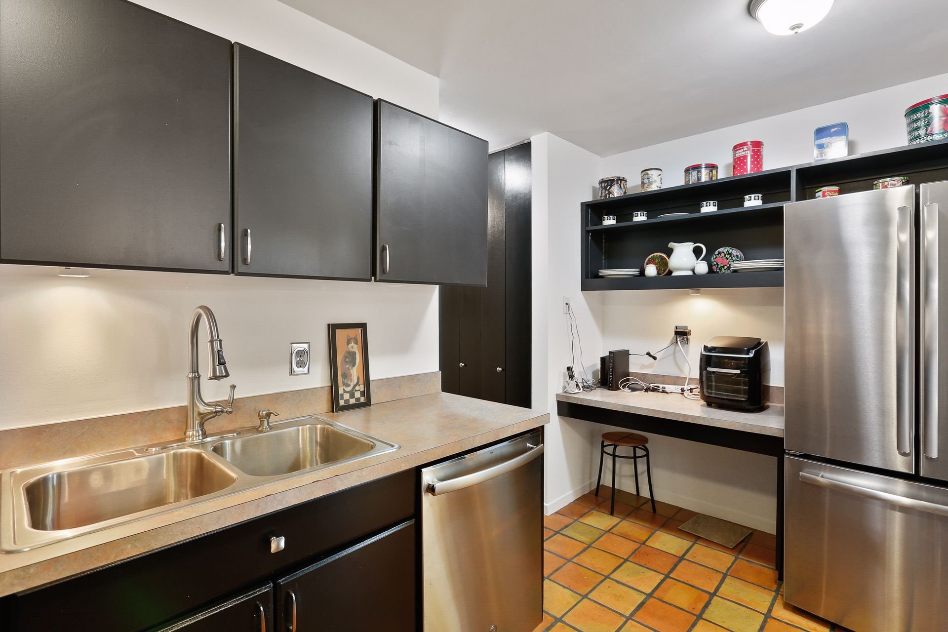 12. Kitchen offers plenty of storage options, prep space, and an eat-in counter.jpg