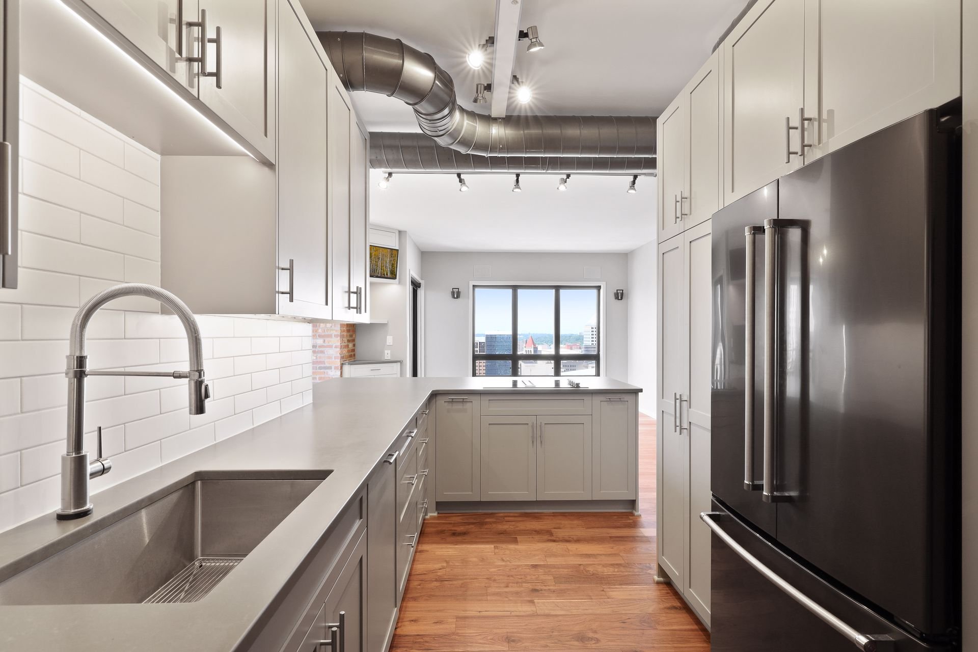 24. Kitchen with hands free faucet and new built in appliances.jpg