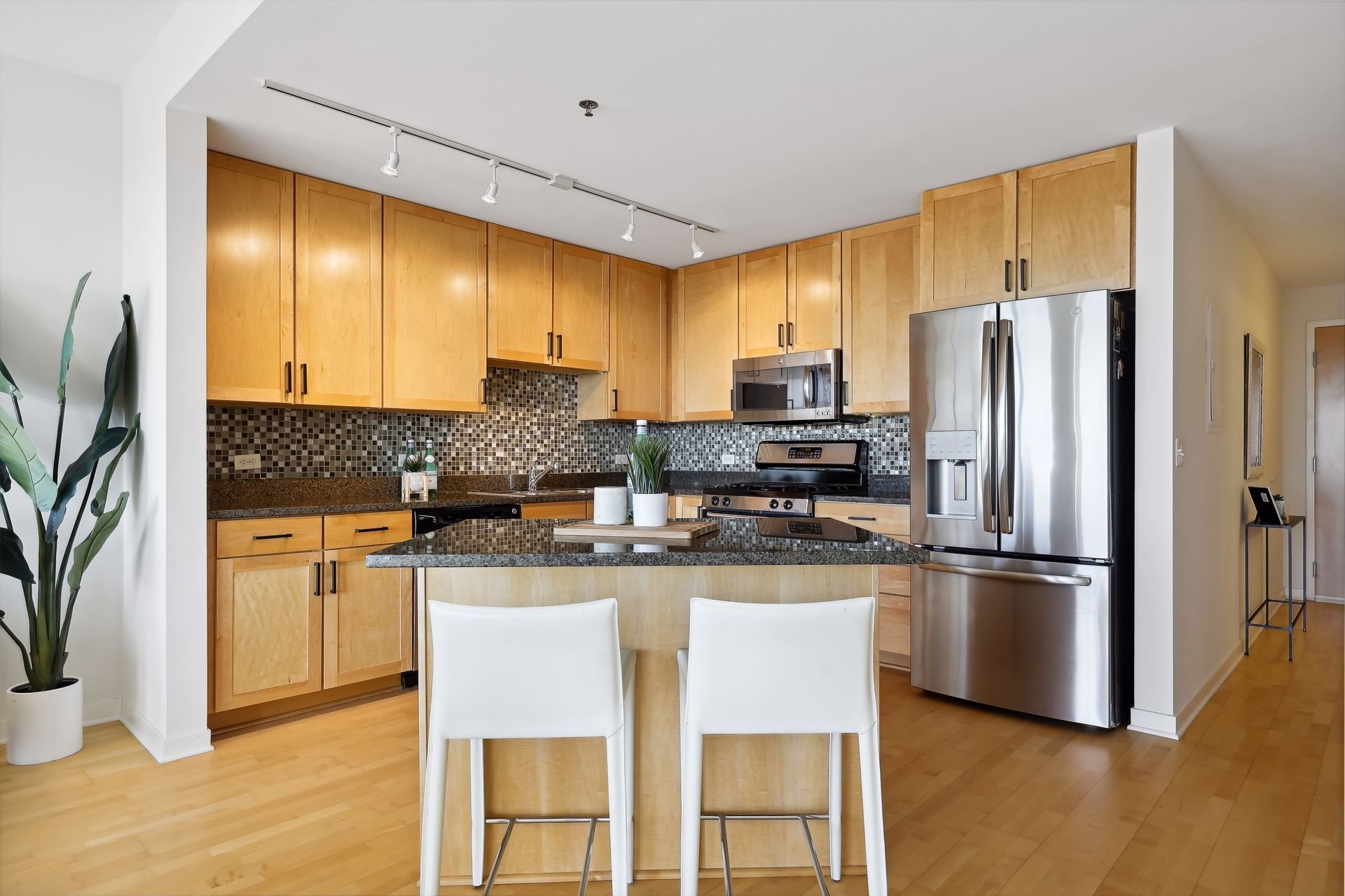 5. Spacious kitchen with new hardware and stainless steel appliances.jpg