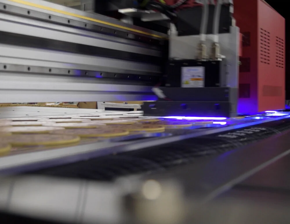 Images of a Fey Industries product being decorated with state of the art equipment.