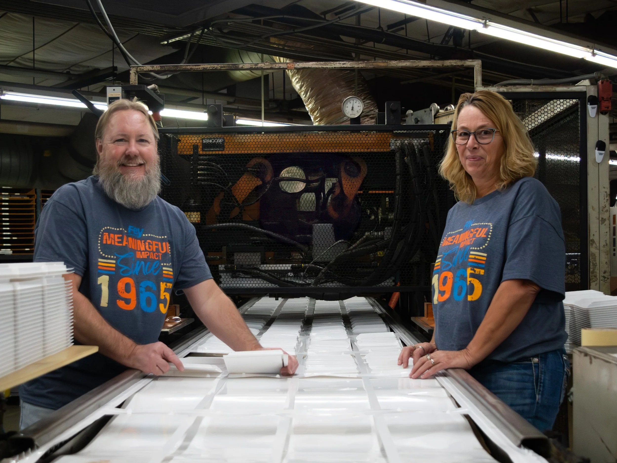 Gallery of images showcasing teamwork and  thermoforming product in one, clean, and climate-controlled environment.