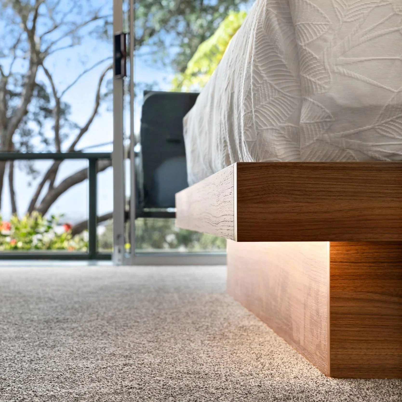illuminated wooden bed frame showing builders attention to detail