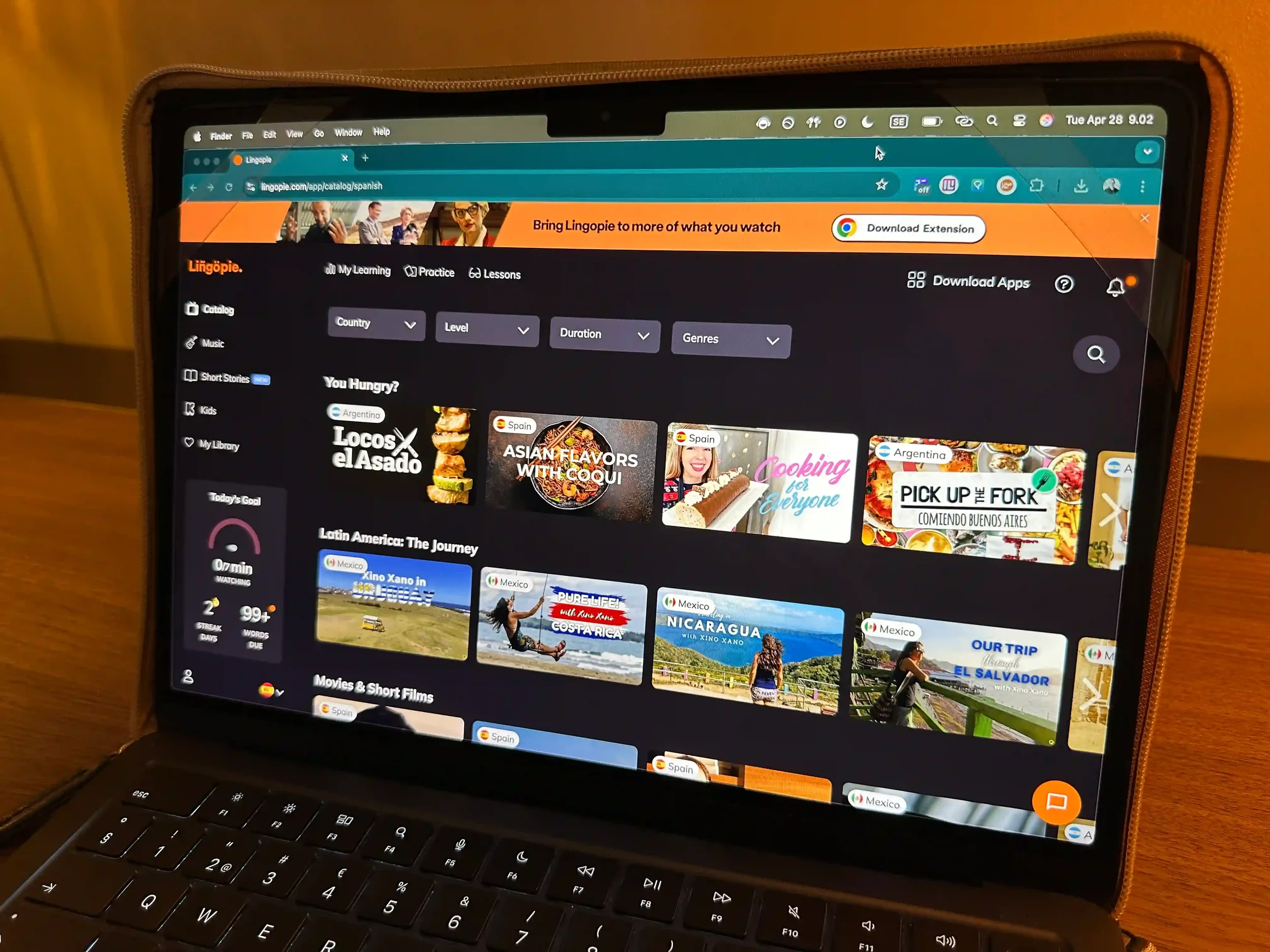 Lingopie's Spanish content library showing categories like cooking shows, travel programs, and Latin American series, with the streak tracker and learning progress visible in the sidebar.
