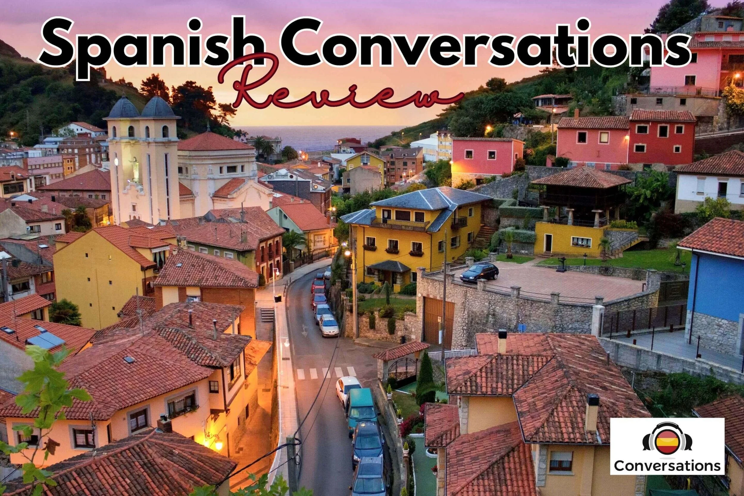 Spanish Conversations by Storylearning course review cover image showing colorful Spanish village representing Villanueva setting where the 20 story-based listening conversations take place for A2-B1 Spanish learners