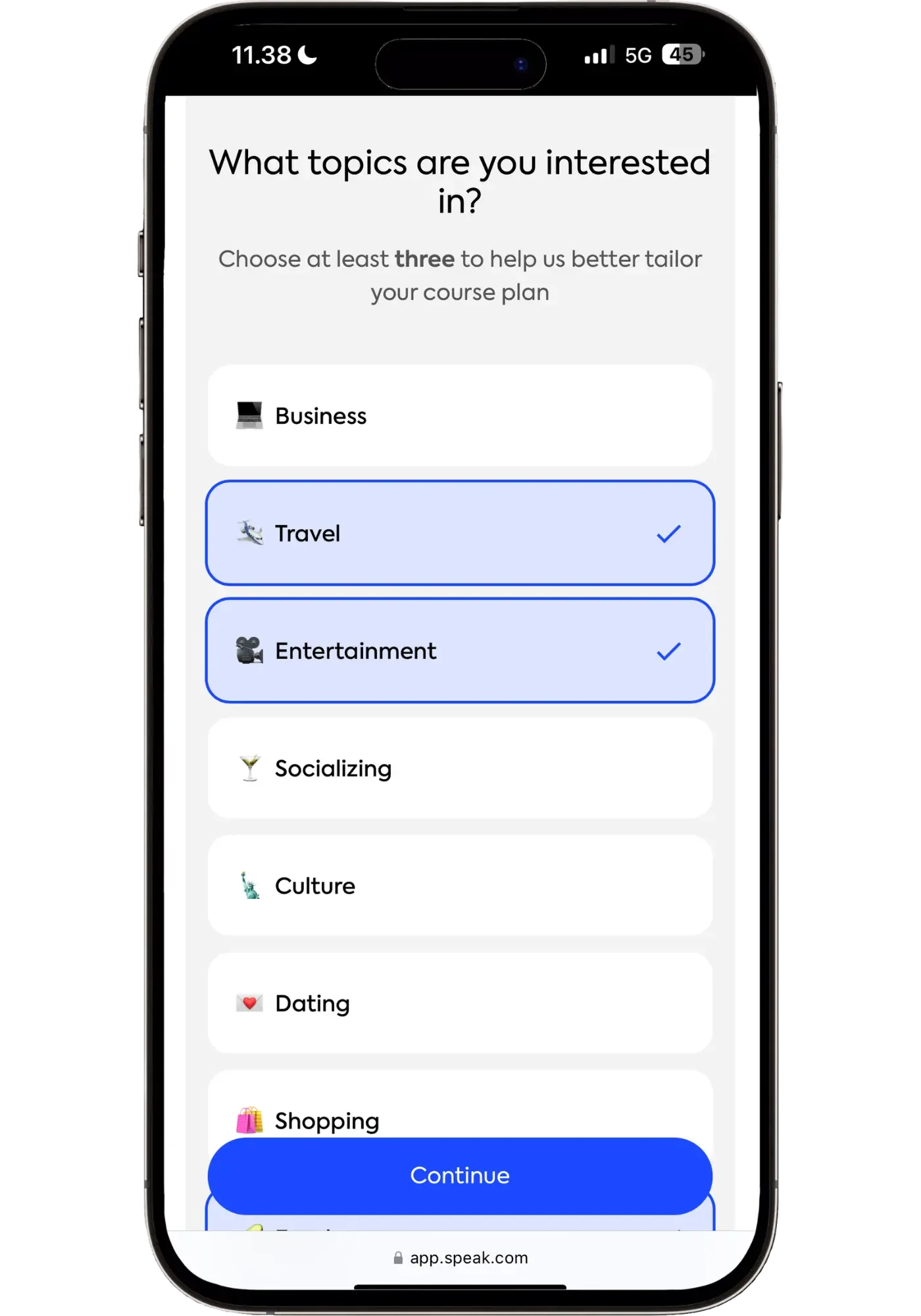 Speak onboarding screen prompting users to choose at least three topics of interest, with Travel and Entertainment selected from a list that includes Business, Socializing, Culture, Dating, and Shopping.