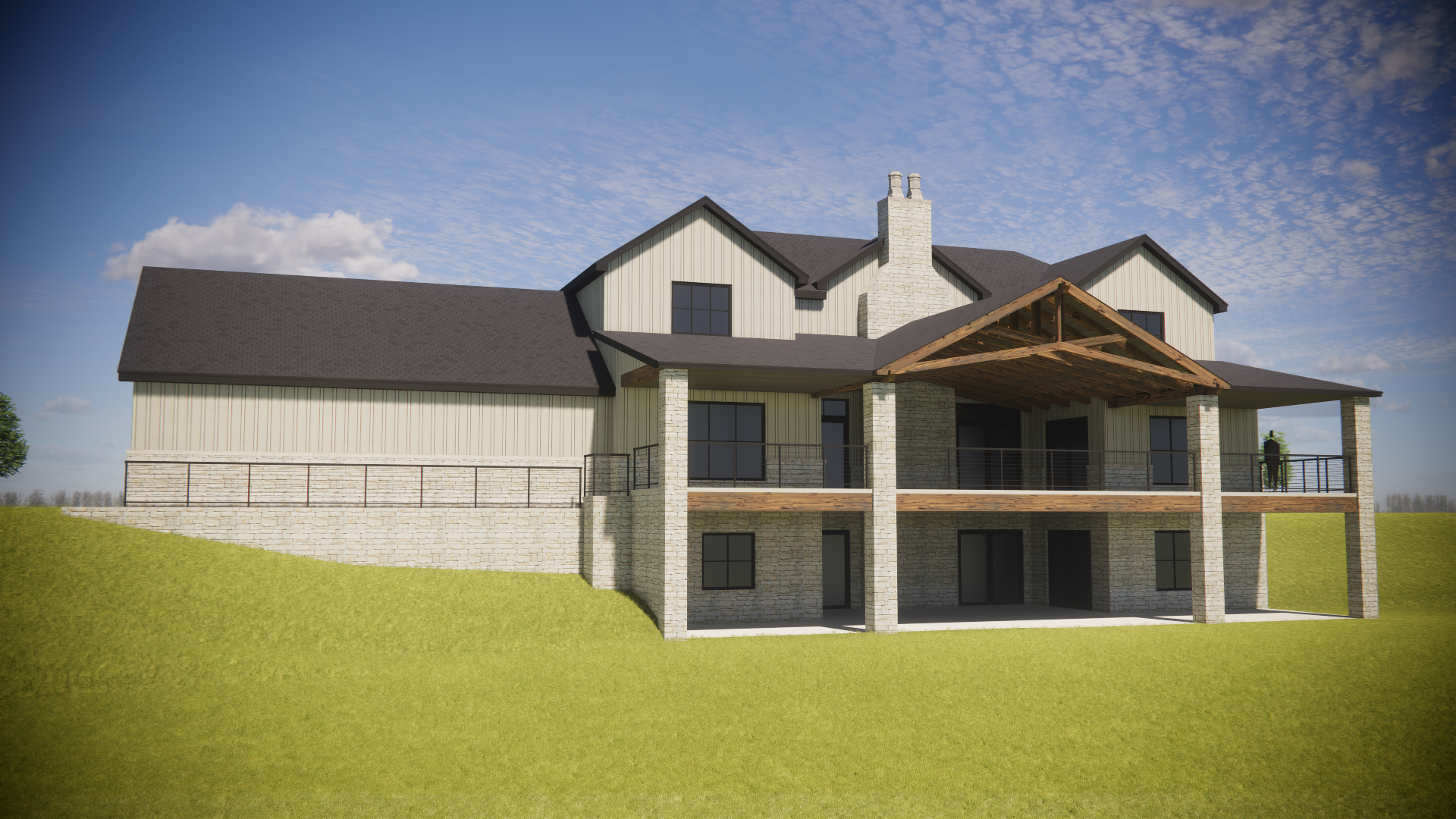A two-story house under construction with a stone foundation, beige siding, and a dark shingle roof, featuring a large porch and a chimney, set on a grassy hill under a partly cloudy sky.