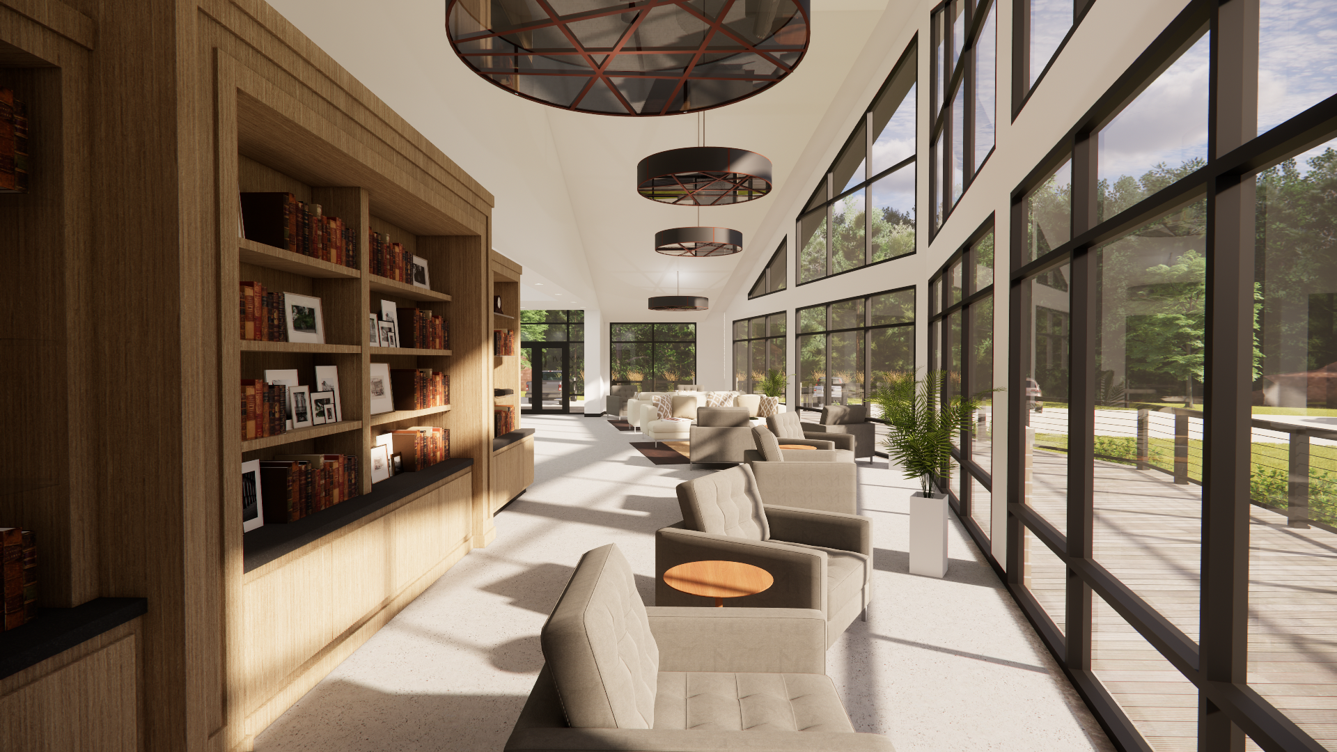Bright indoor lounge area with large floor-to-ceiling windows, several beige armchairs with small round tables, a wooden bookshelf filled with books and framed photos, and modern circular ceiling lights. Outside, there is a wooden deck with a railing