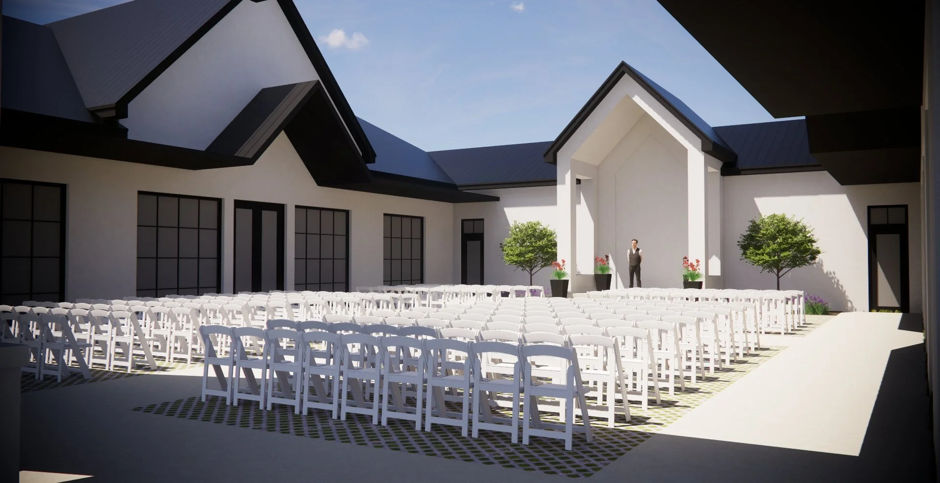 Outdoor wedding ceremony setup in a modern courtyard with white folding chairs in front of a small stage, potted trees, and flowers under a blue sky.