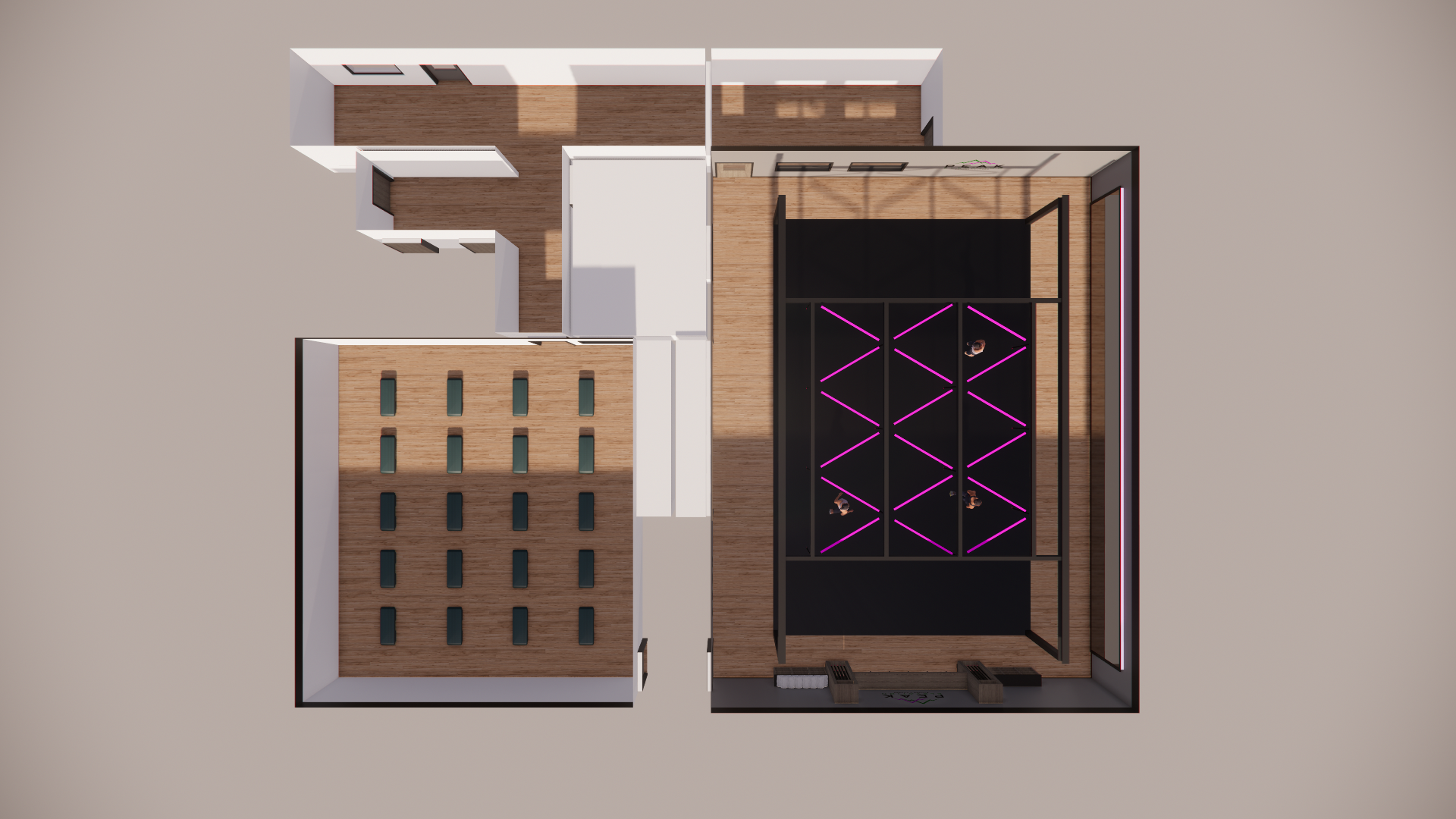 Top-down view of an interior space with a stage, seating area, and multiple rooms including a hallway and what appears to be a restroom area.