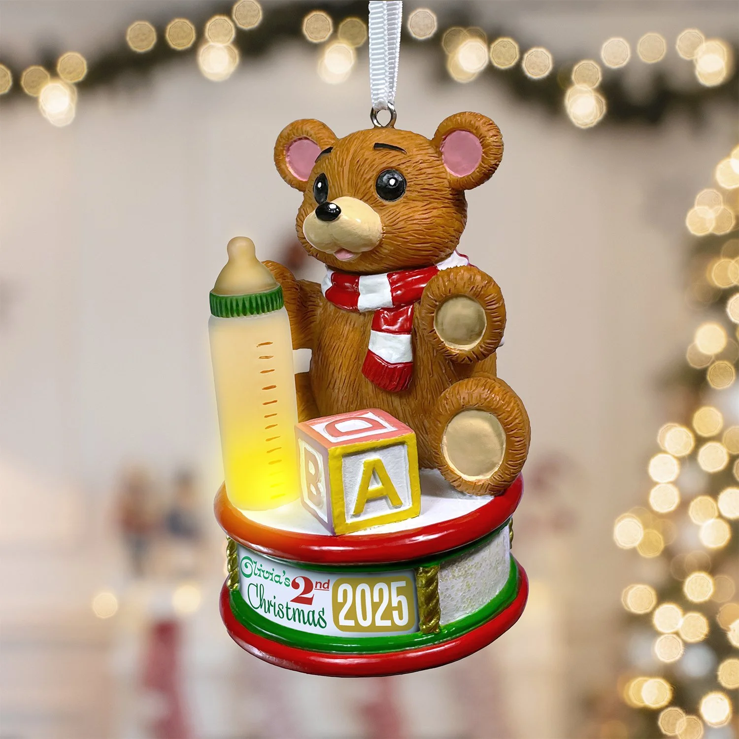 Hand-painted teddy bear ornament in vibrant holiday colors for little ones