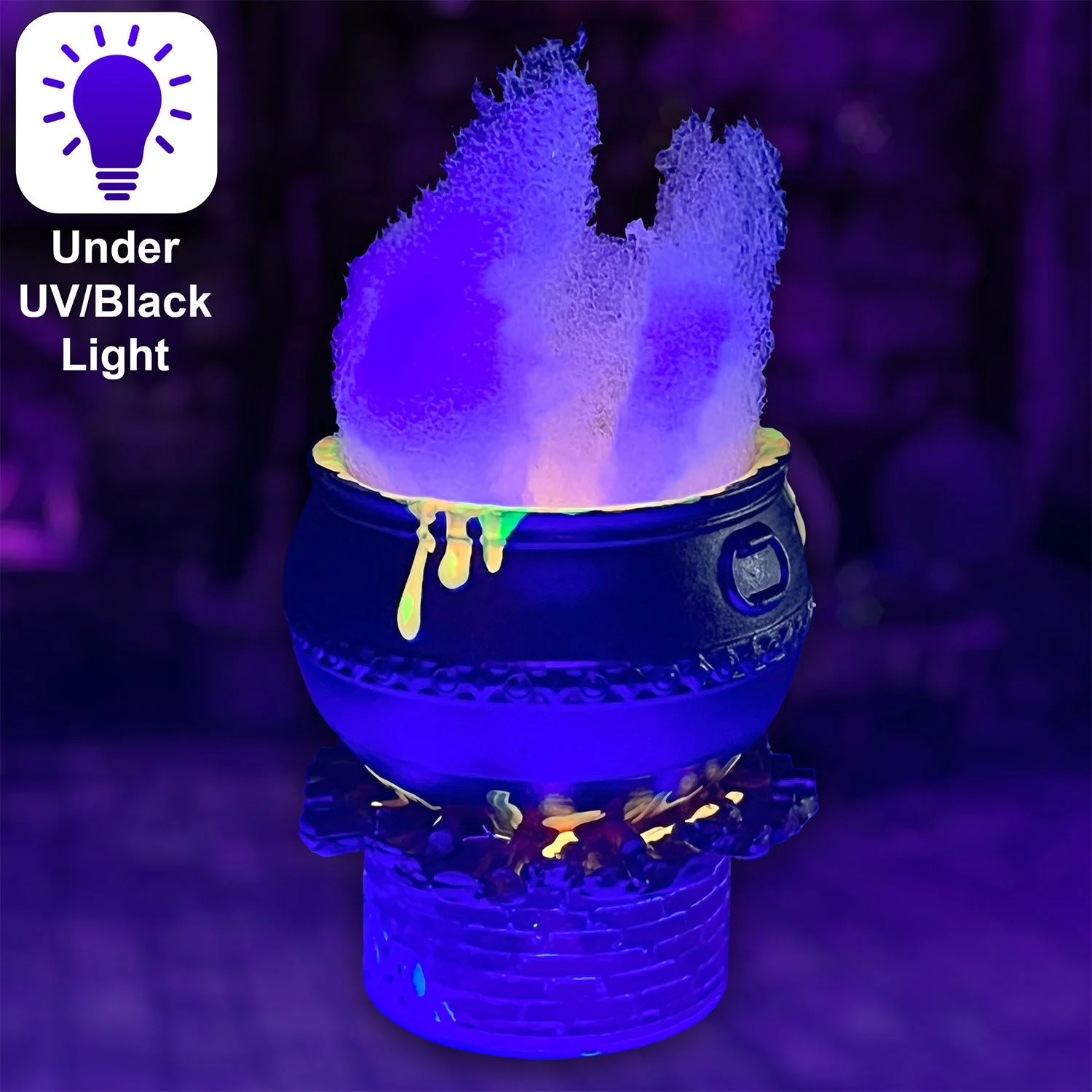 Black resin witch cauldron with glowing potion and flames under UV light