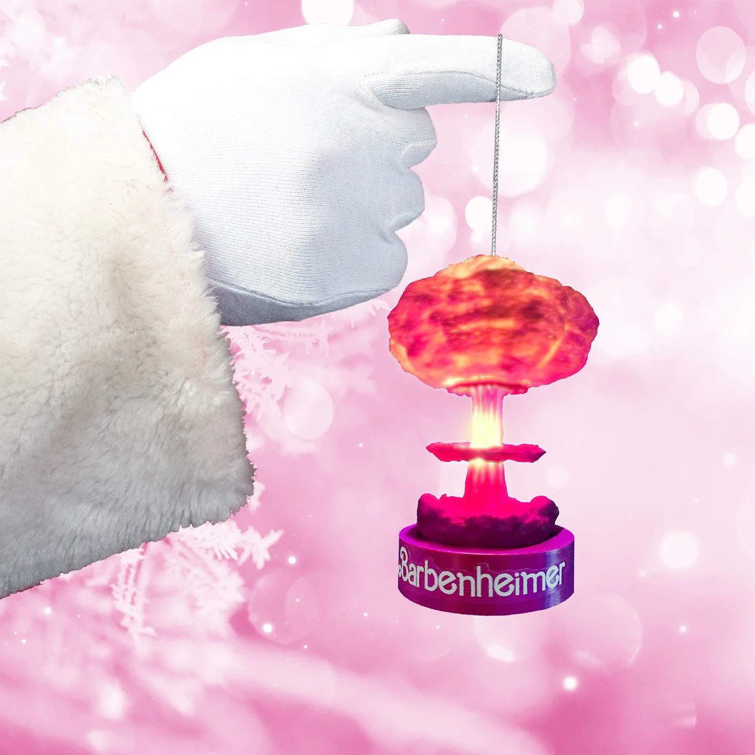 Hand-painted nuclear explosion ornament in pink tones with replaceable batteries