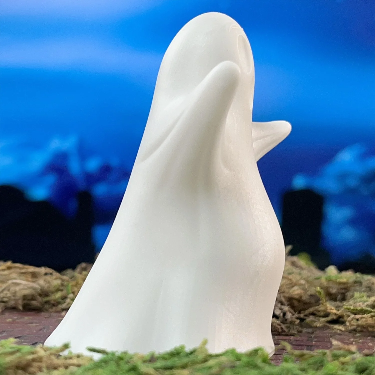 Gordo Ghost Halloween ornament glowing with LED light on table or desk