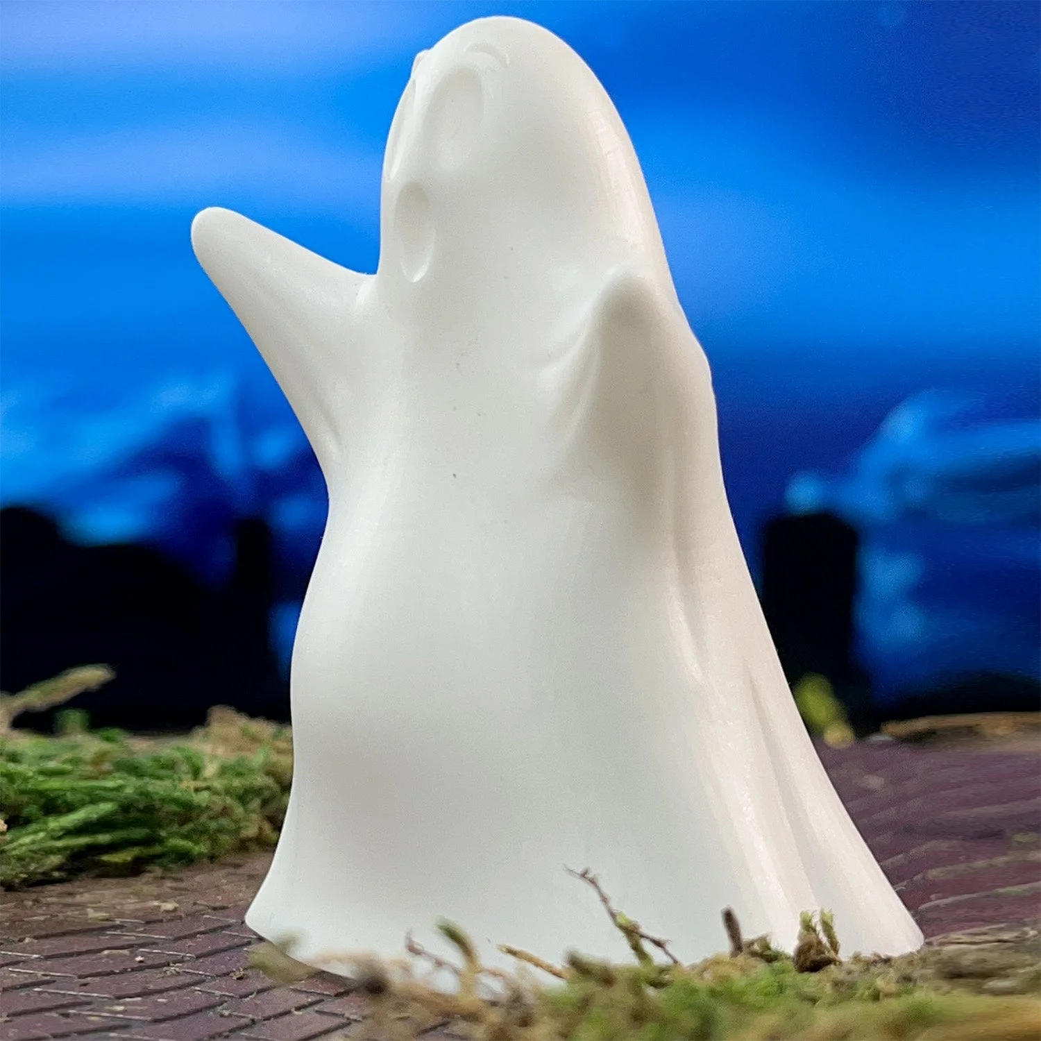 Friendly glowing Gordo Ghost ornament made of shatter-resistant white resin