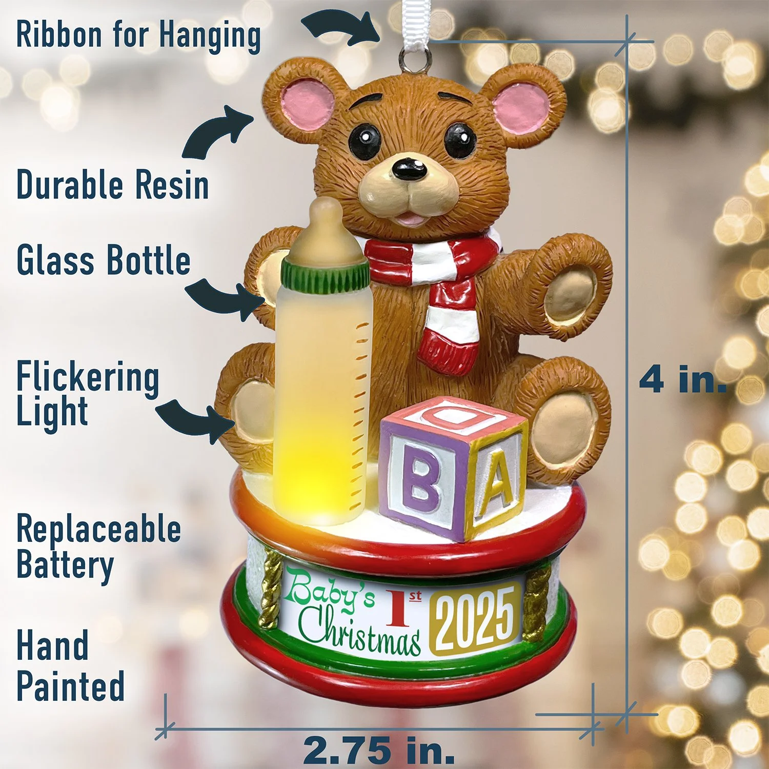 Baby's first Christmas ornament with teddy bear, letter cube, and flickering light