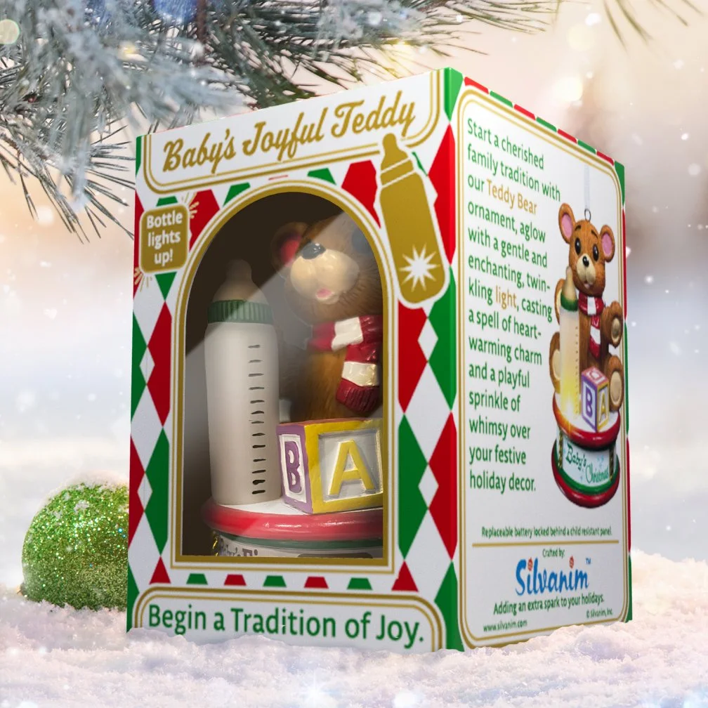 Light-accented baby ornament packaged for gifting with festive holiday presentation