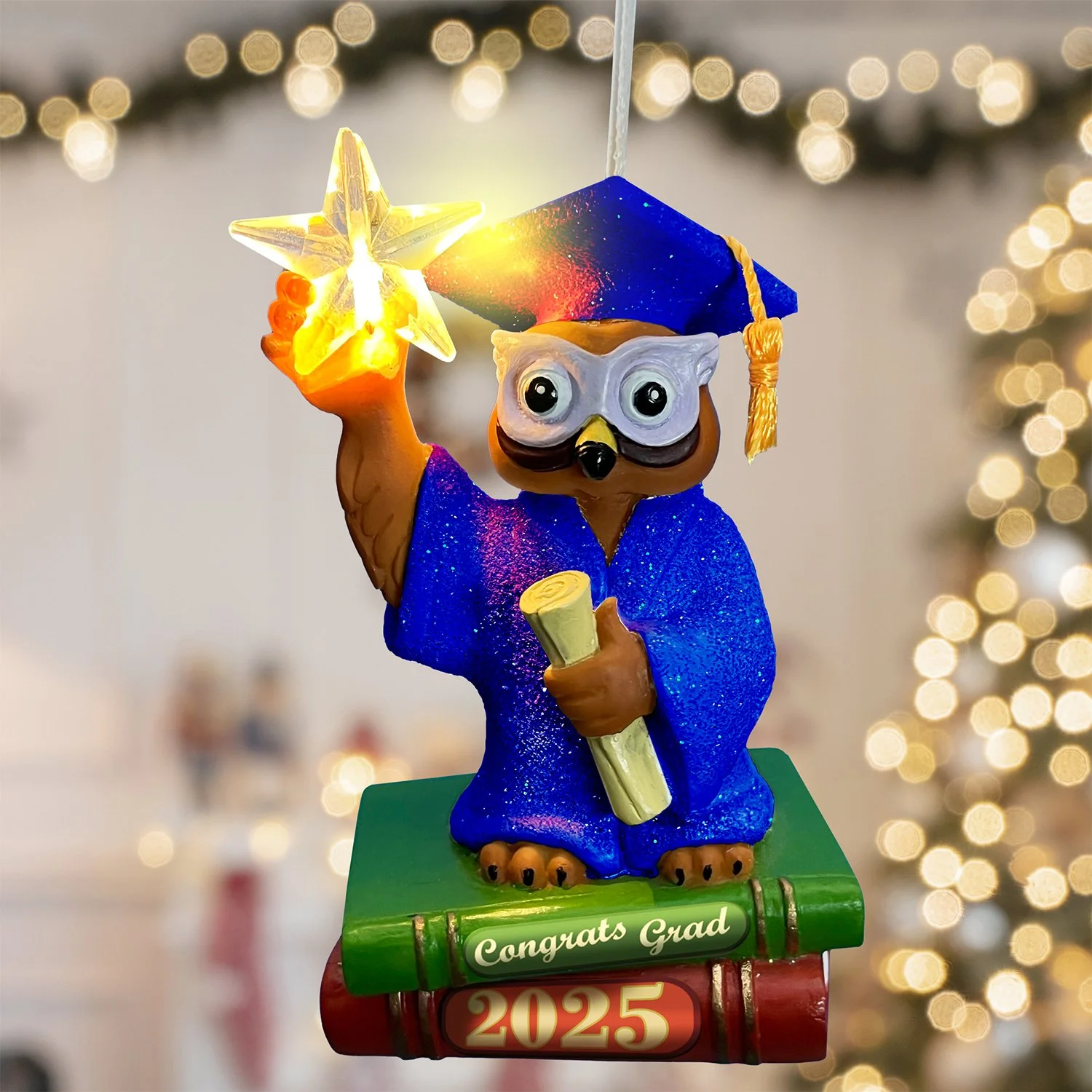 Blue gown graduation owl tree ornament with glowing acrylic star and ribbon hanger