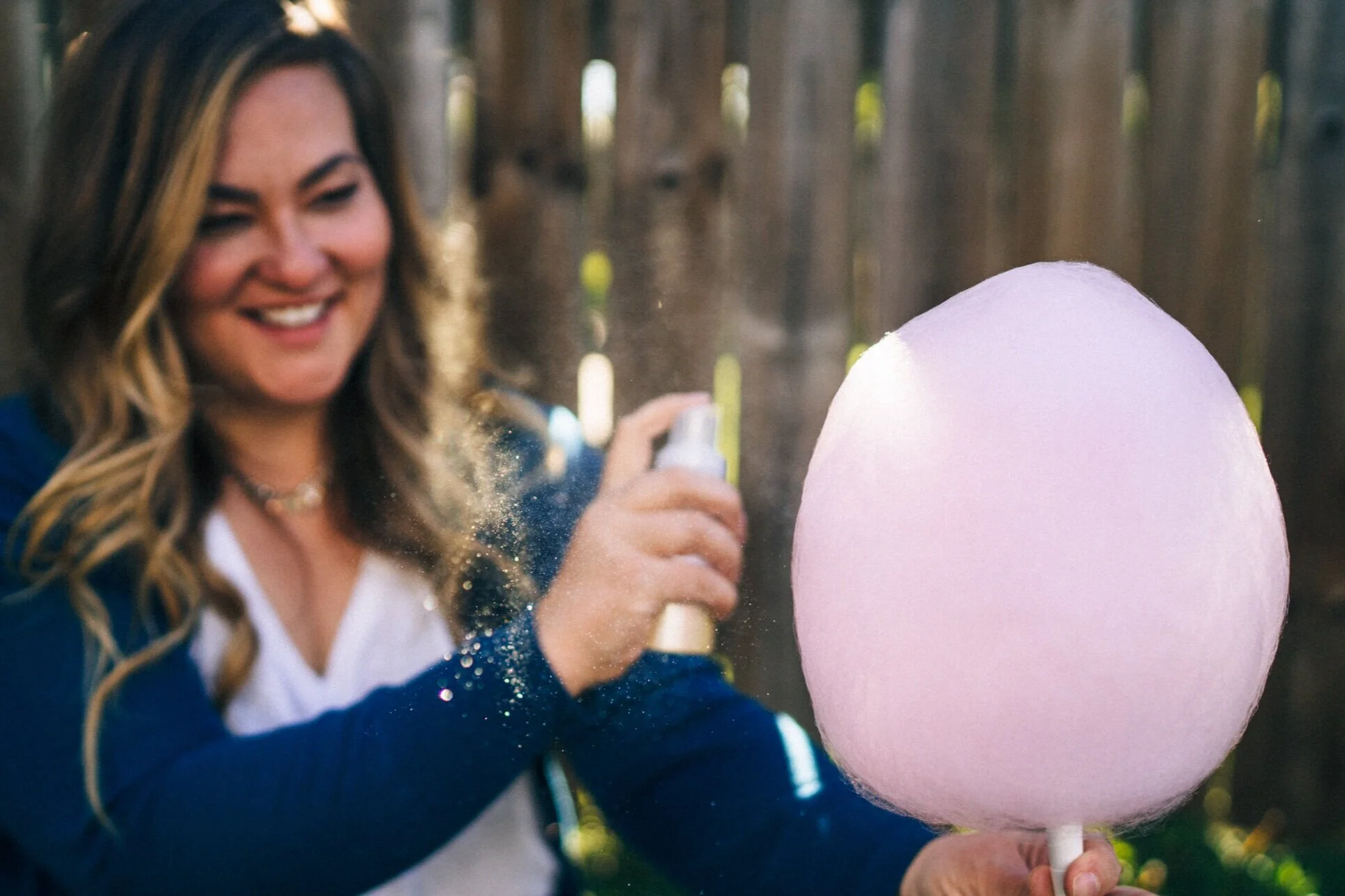 Spraying glitter on cotton candy