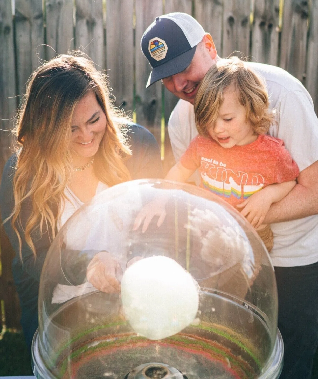 Family watching the making of cotton candy