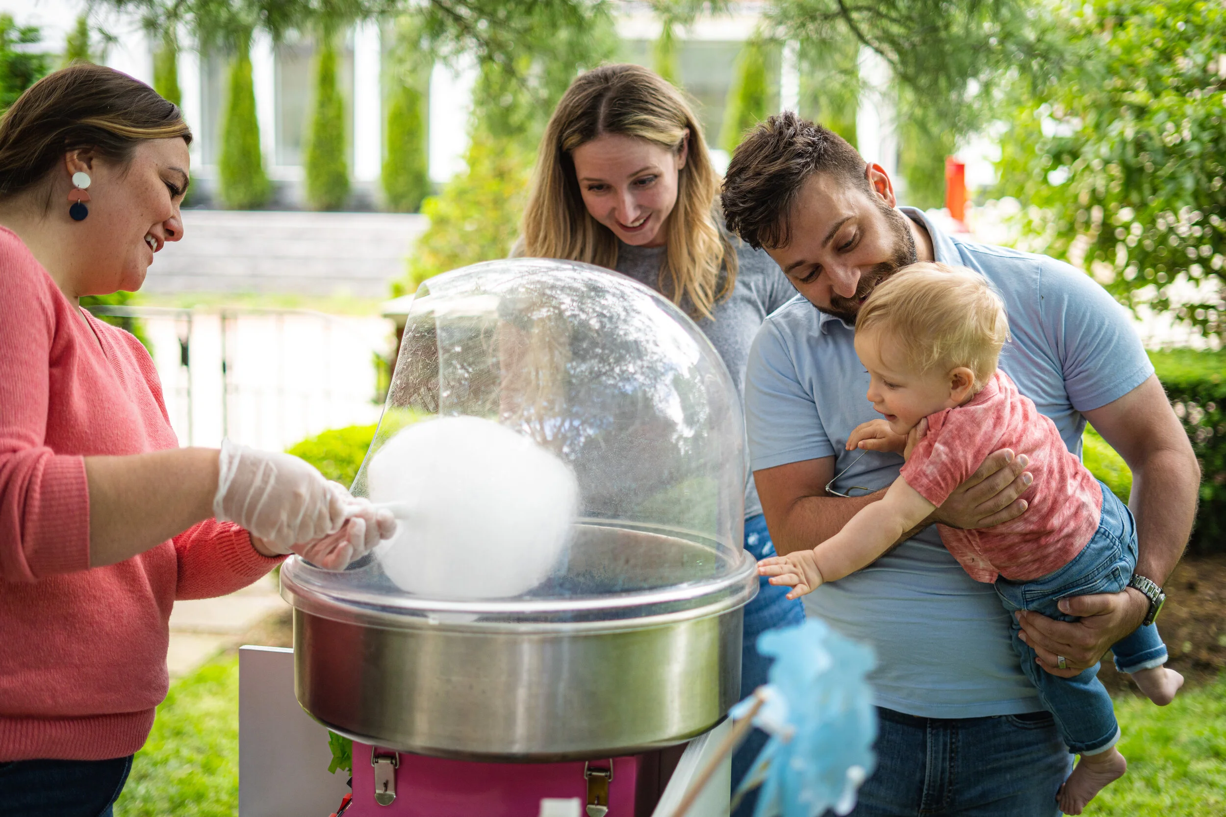 Toddler watching the making of cotton candy