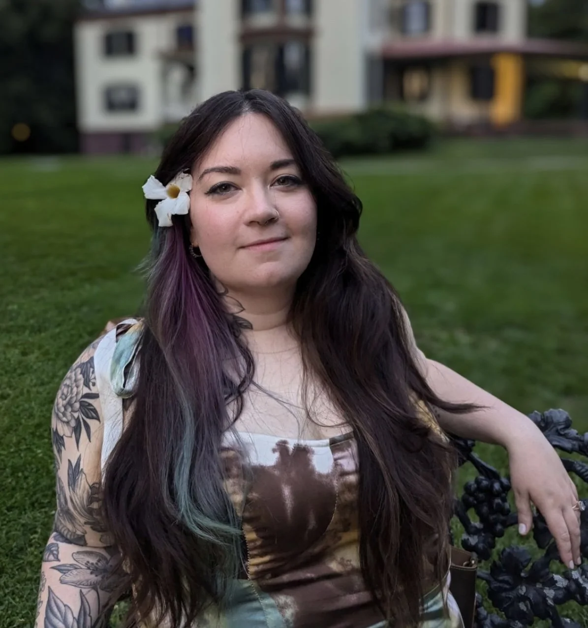 woman with flower in purple and blue hair