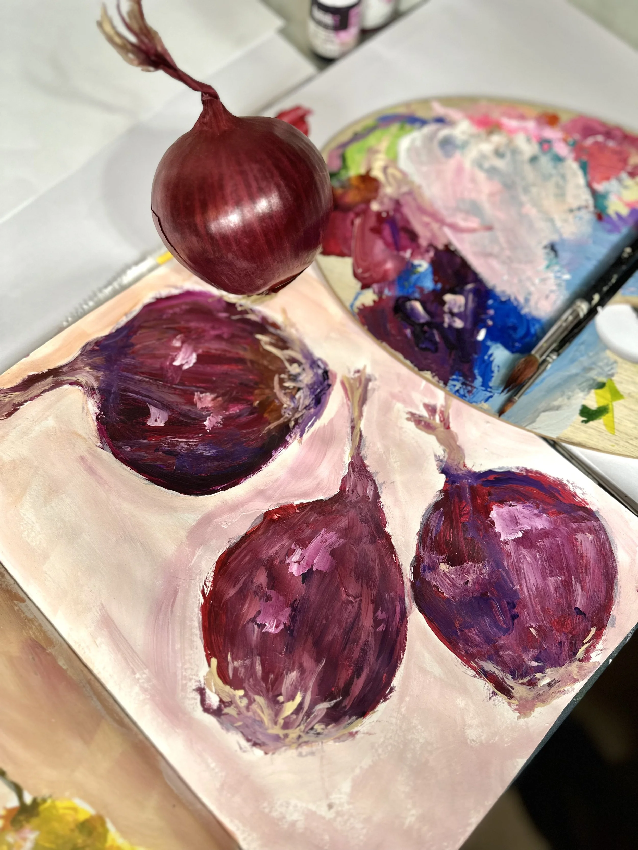 loose expressive painting of red onions in sketchbook
