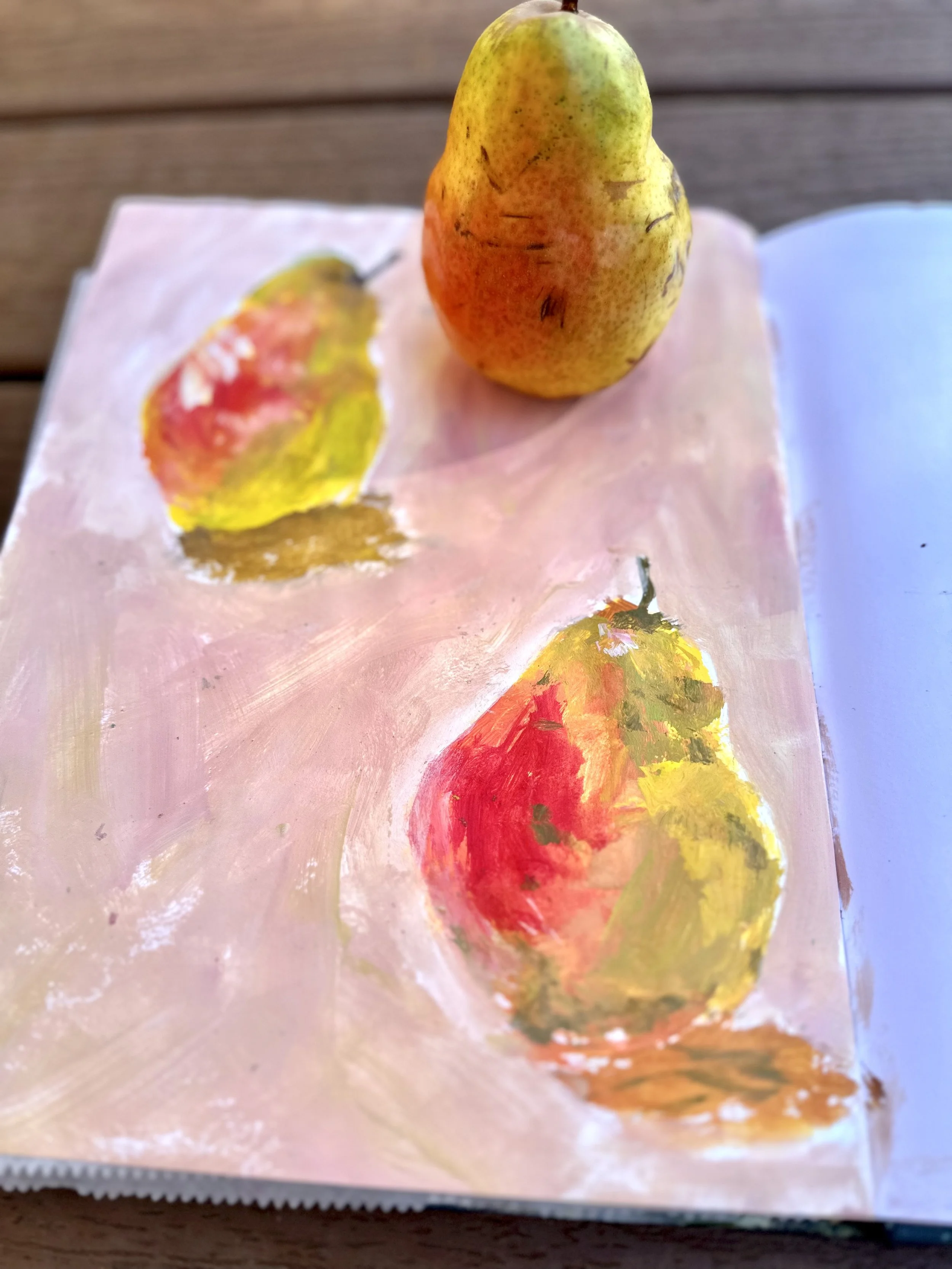 Loose expressive painting of pears in sketchbook