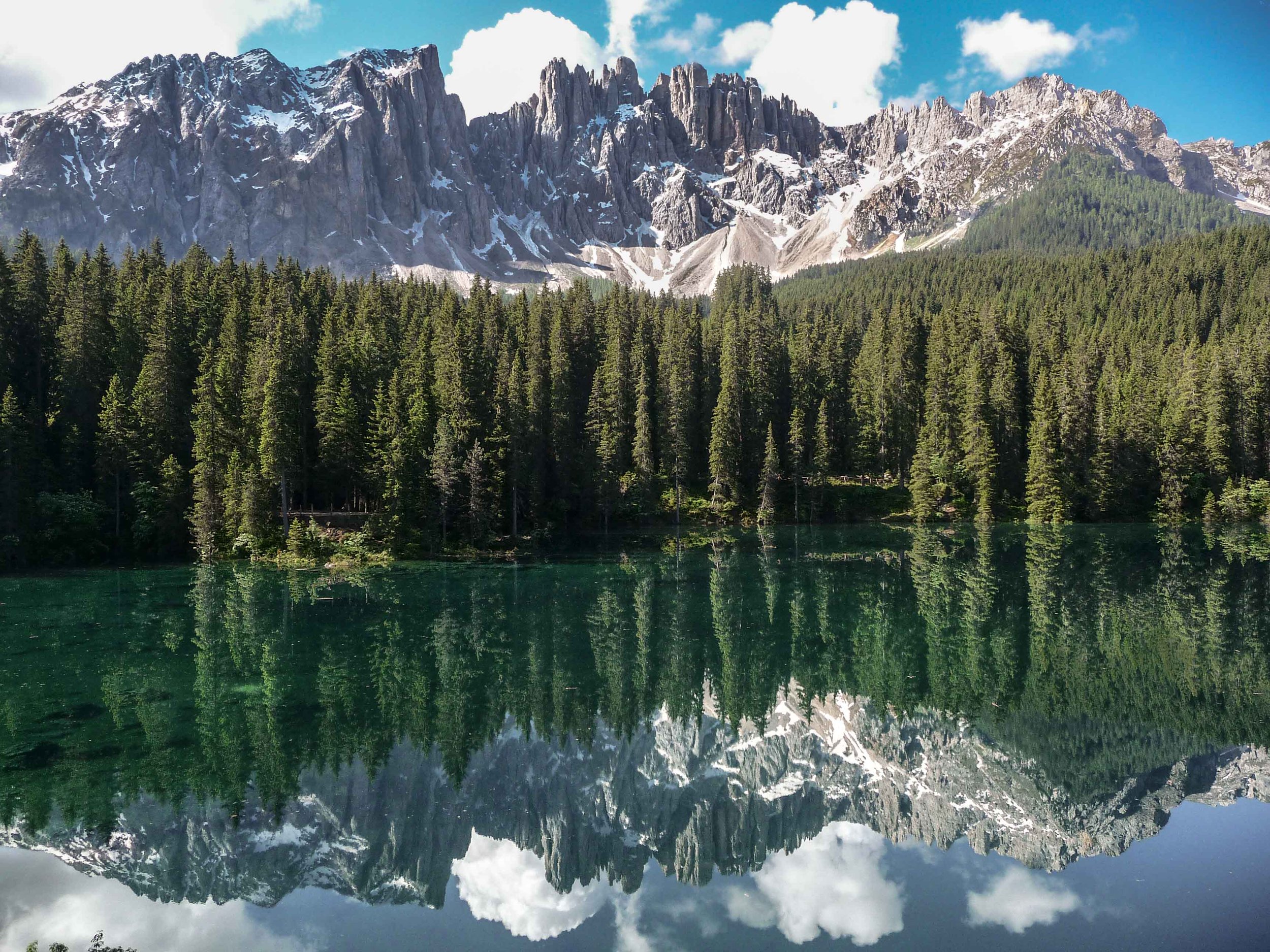 Dolomite mountains in Northern Italy reflected in an alpine lake