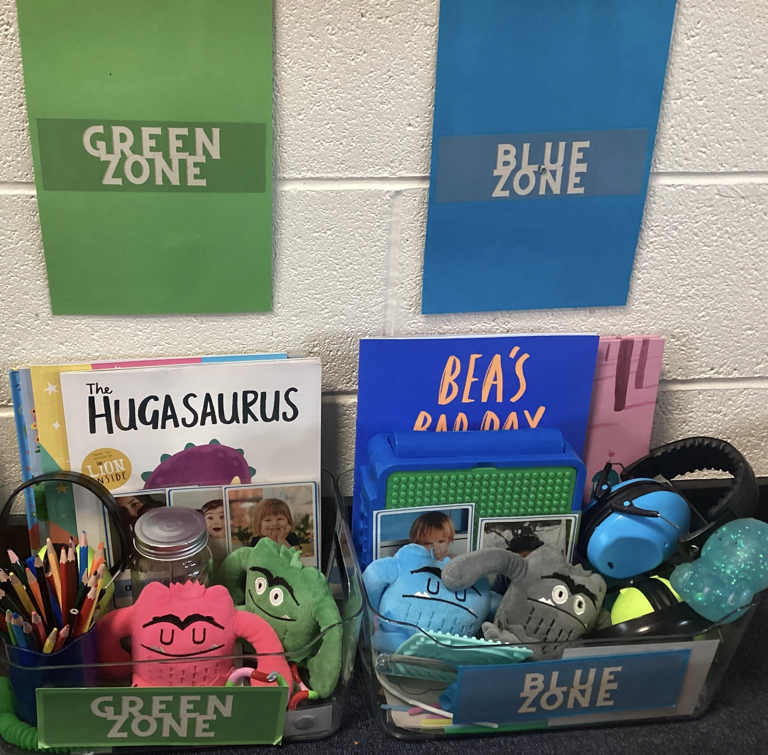An example of our Zones of Regulation Toolboxes Green and Blue , within class with a variety of reading books and resources that all children can access throughout the day to regulate, ready to learn.