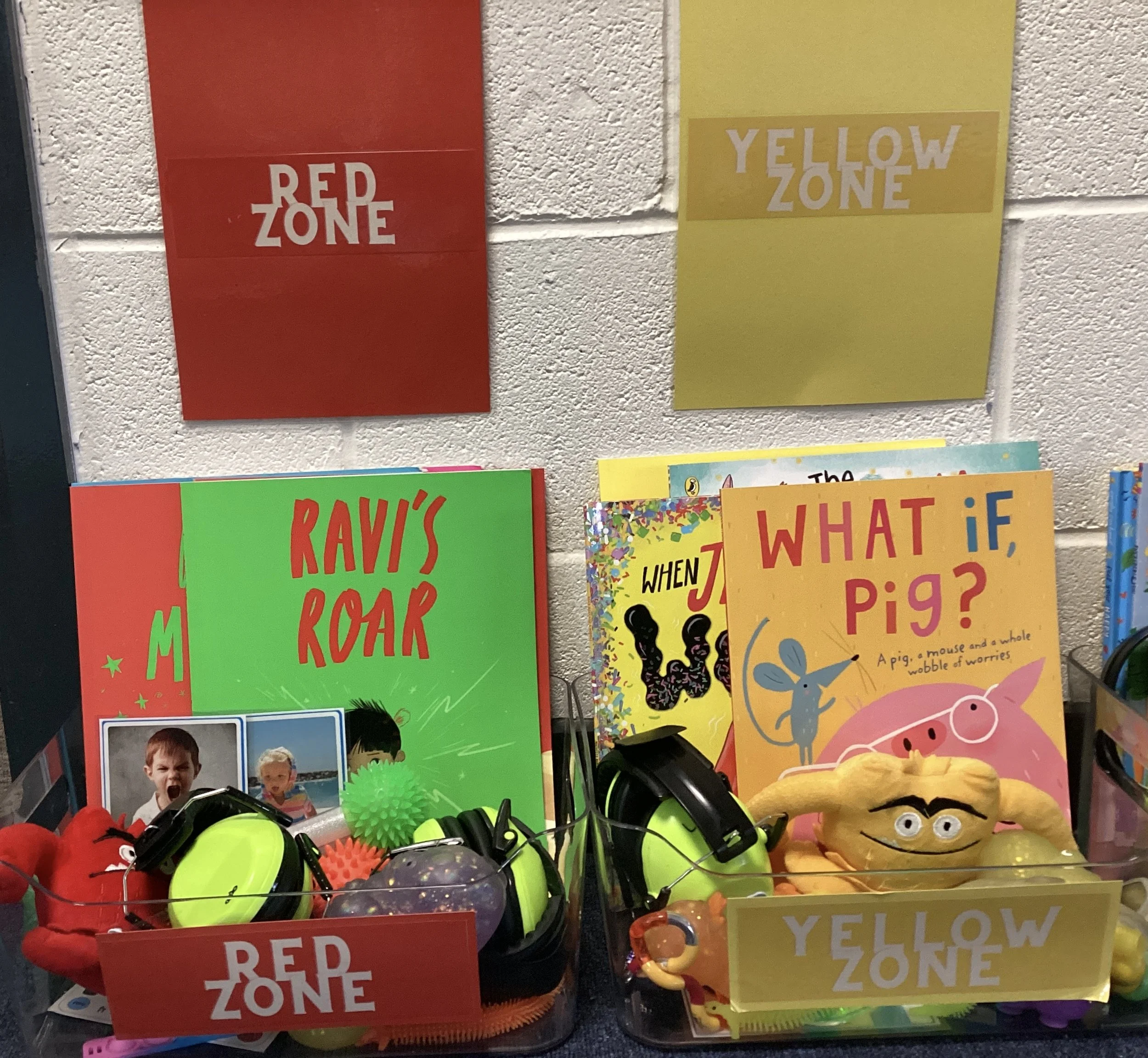 An example of our Zones of Regulation Toolboxes Red & Yellow, within class with a variety of reading books and resources that all children can access throughout the day to regulate, ready to learn.