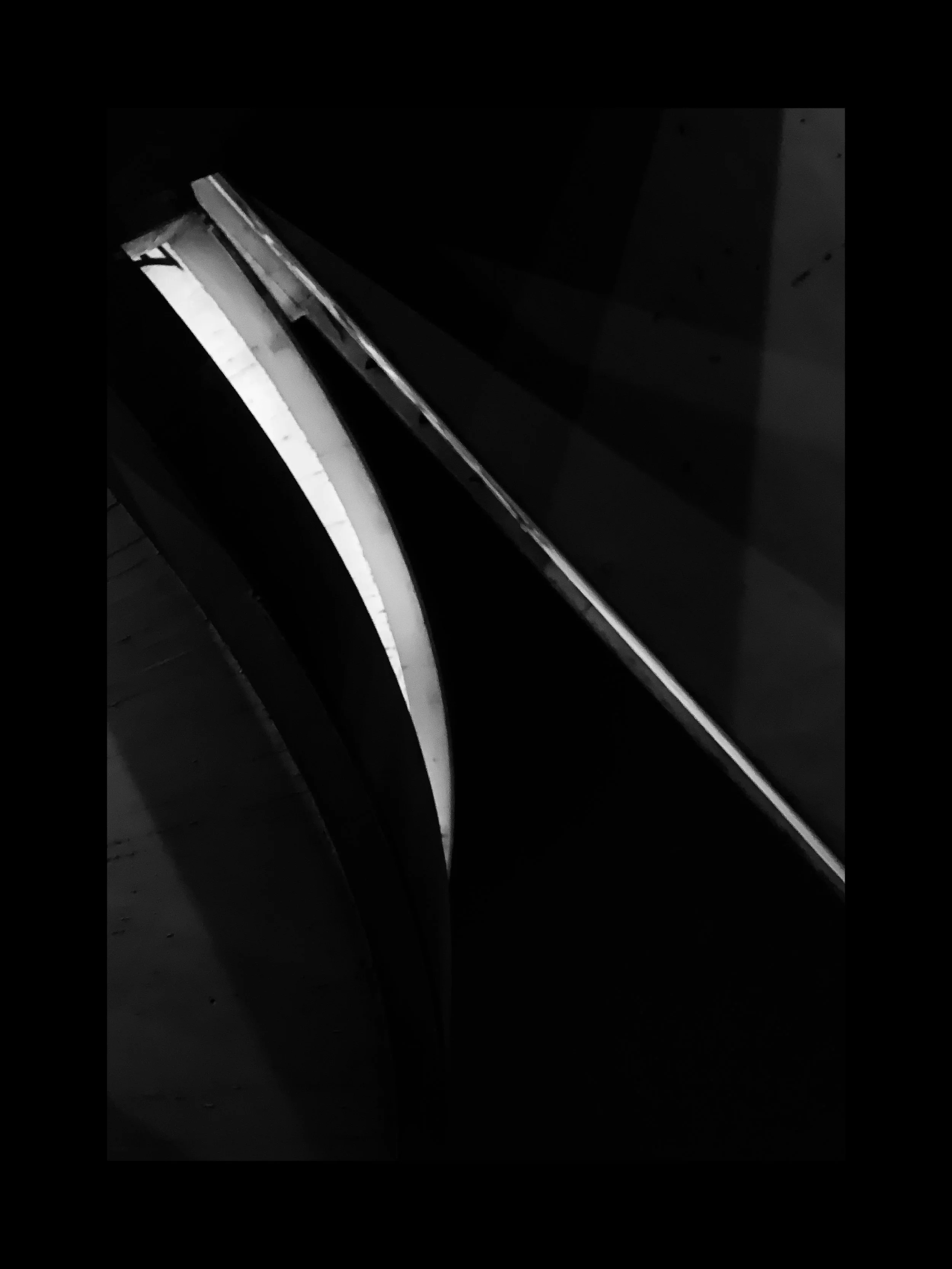 Close-up of a piano keyboard, highlighting the keys and a part of the black surface.