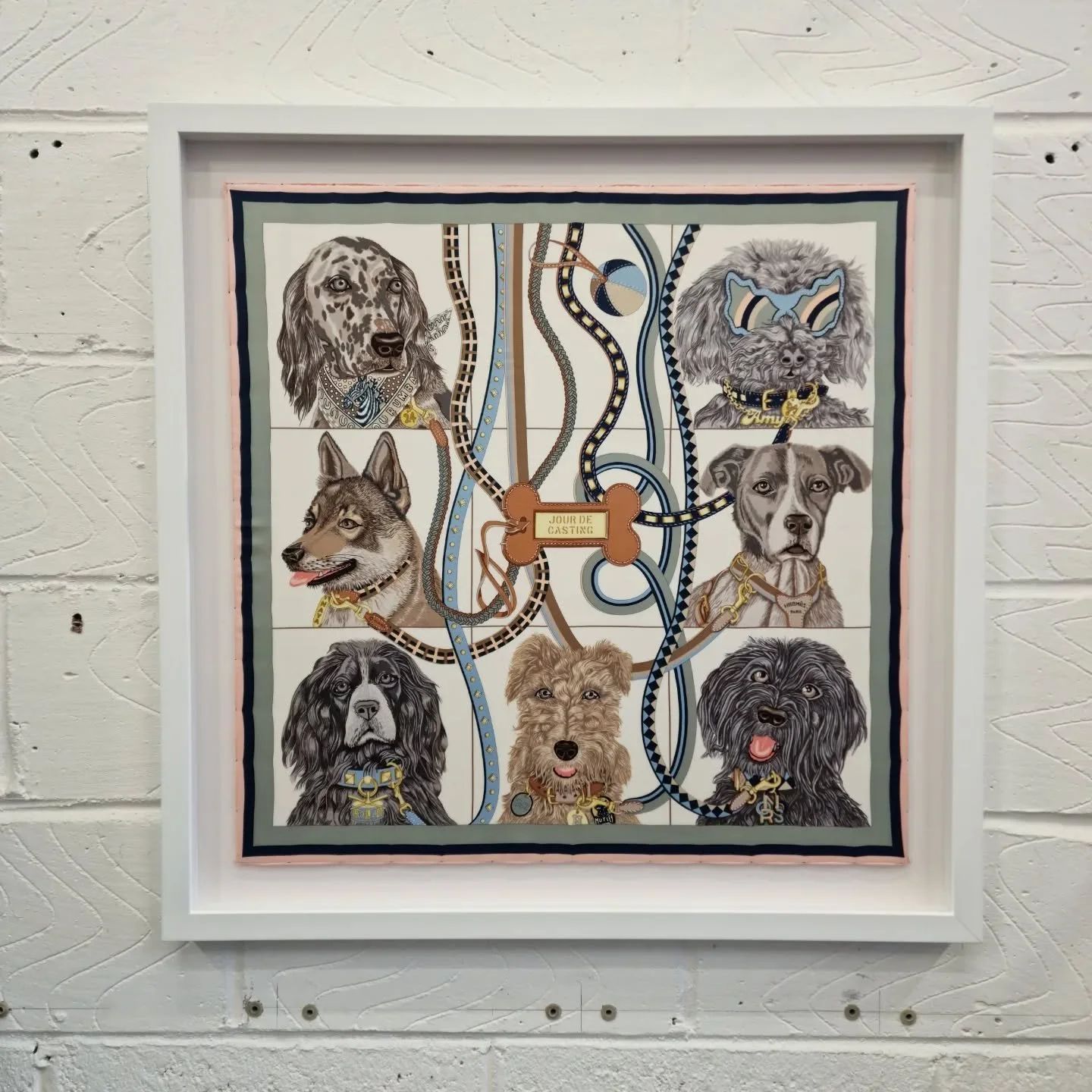 Framed and ready to go home. 

Hermes sill scarf of a pack of friendly dogs.

Float mounted to a white background and a deep rebated white frame.

Our unique way of framing scarves has become extremely popular. More examples to come in the next few w