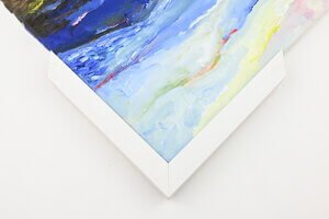 Canvas with a traditional frame over the top of the edge of the canvas.