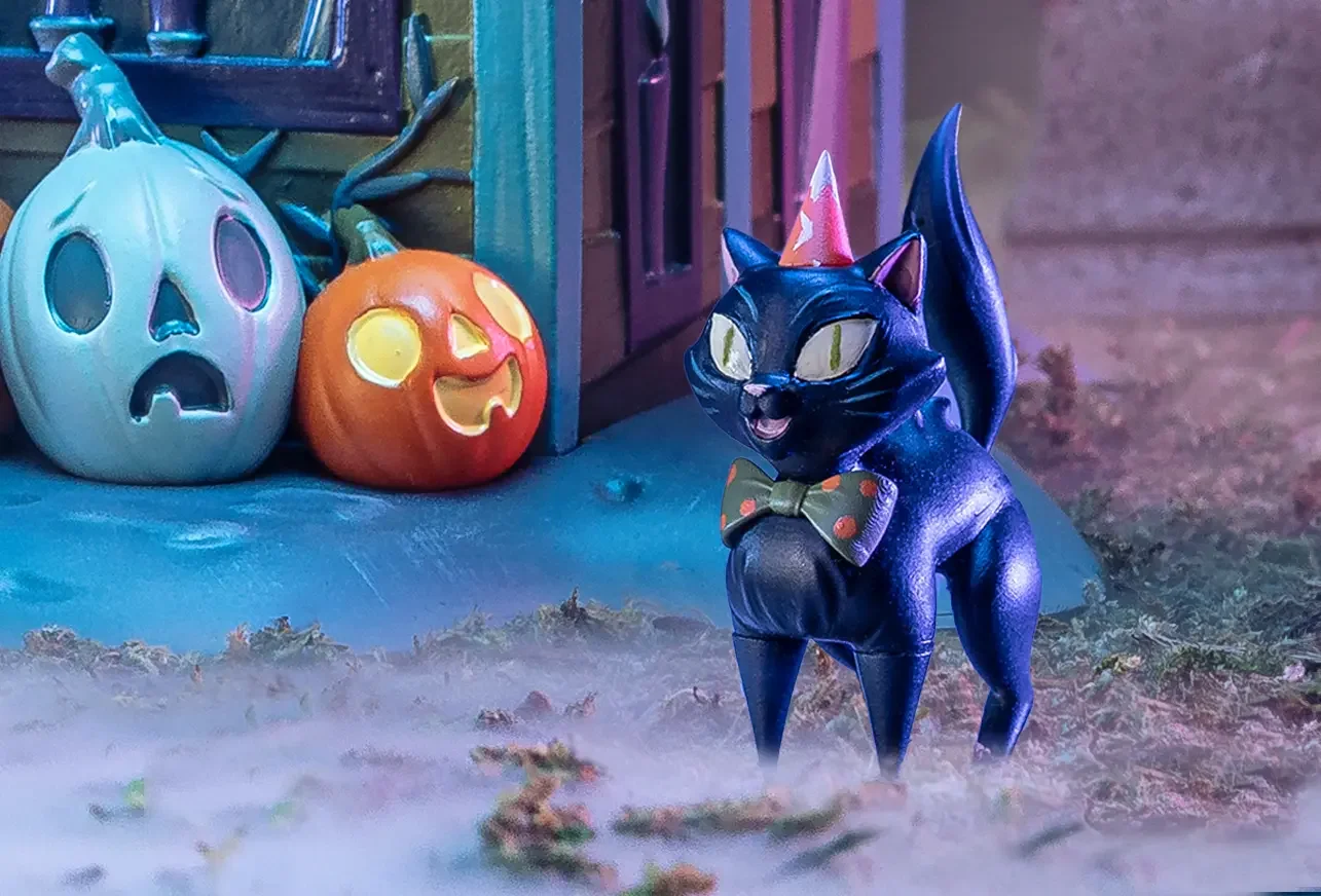 Stephanie Buscema black cat familiar resin figure from the Black Cat Chateau set, wearing party hat and polka dot bow tie