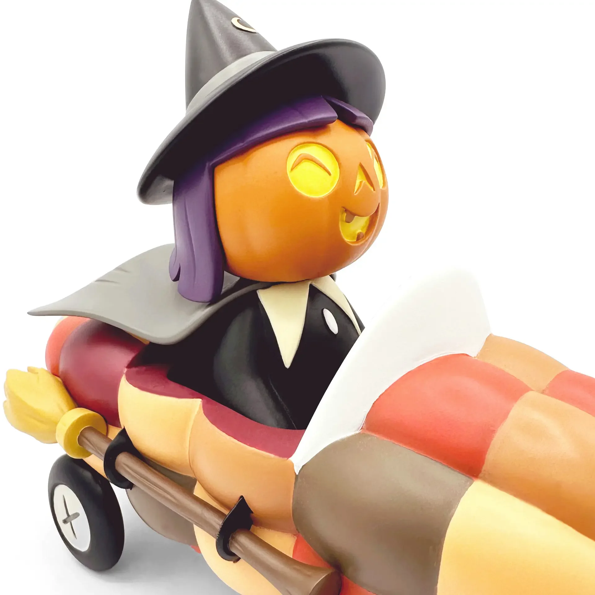 Stephanie Buscema Willa the Way-Out Witch close-up showing pumpkin head, glowing eyes, witch hat, and purple hair detail