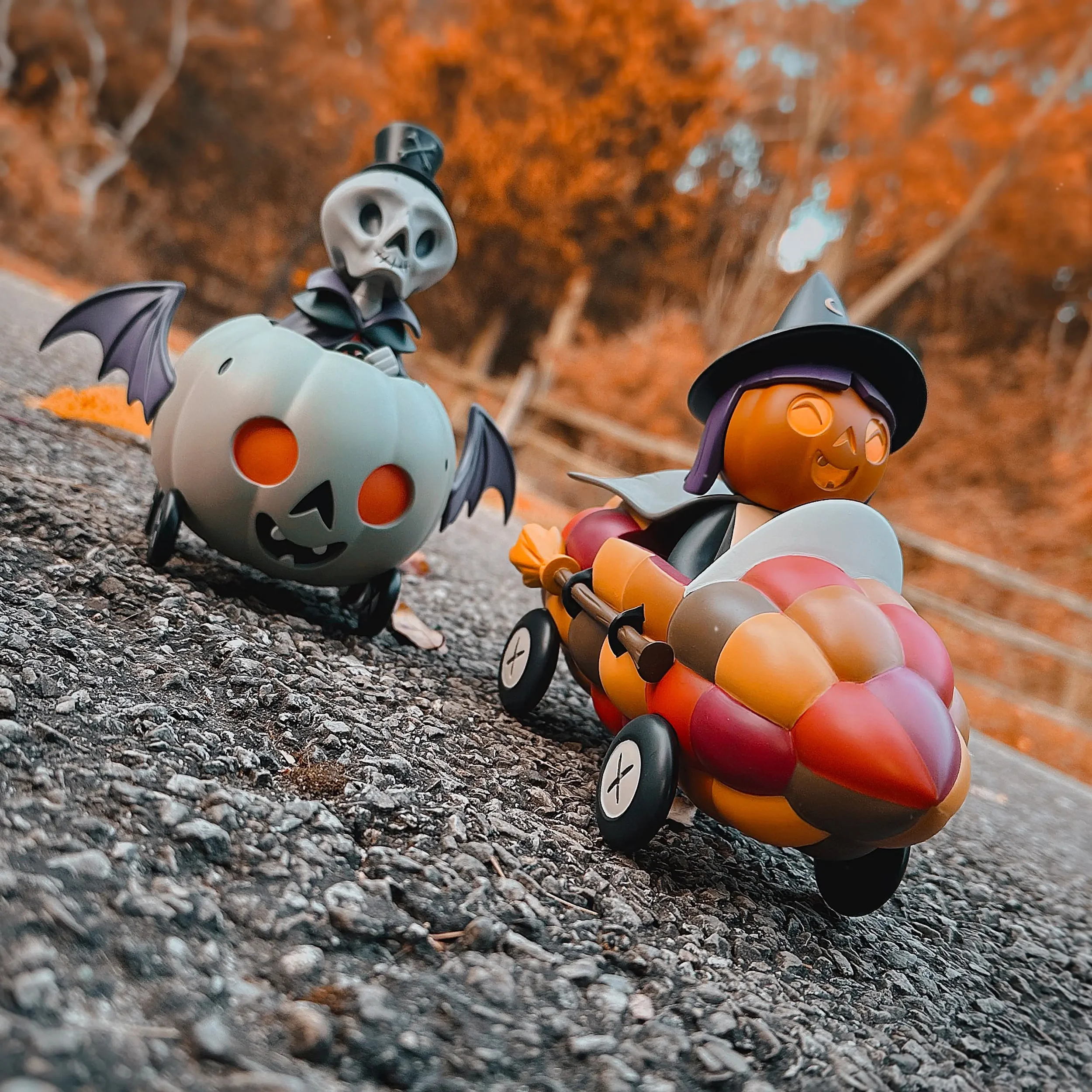 Stephanie Buscema Corny Cruisers: Willa the Way-Out Witch leading Nigel the Necromancer racing downhill on autumn road