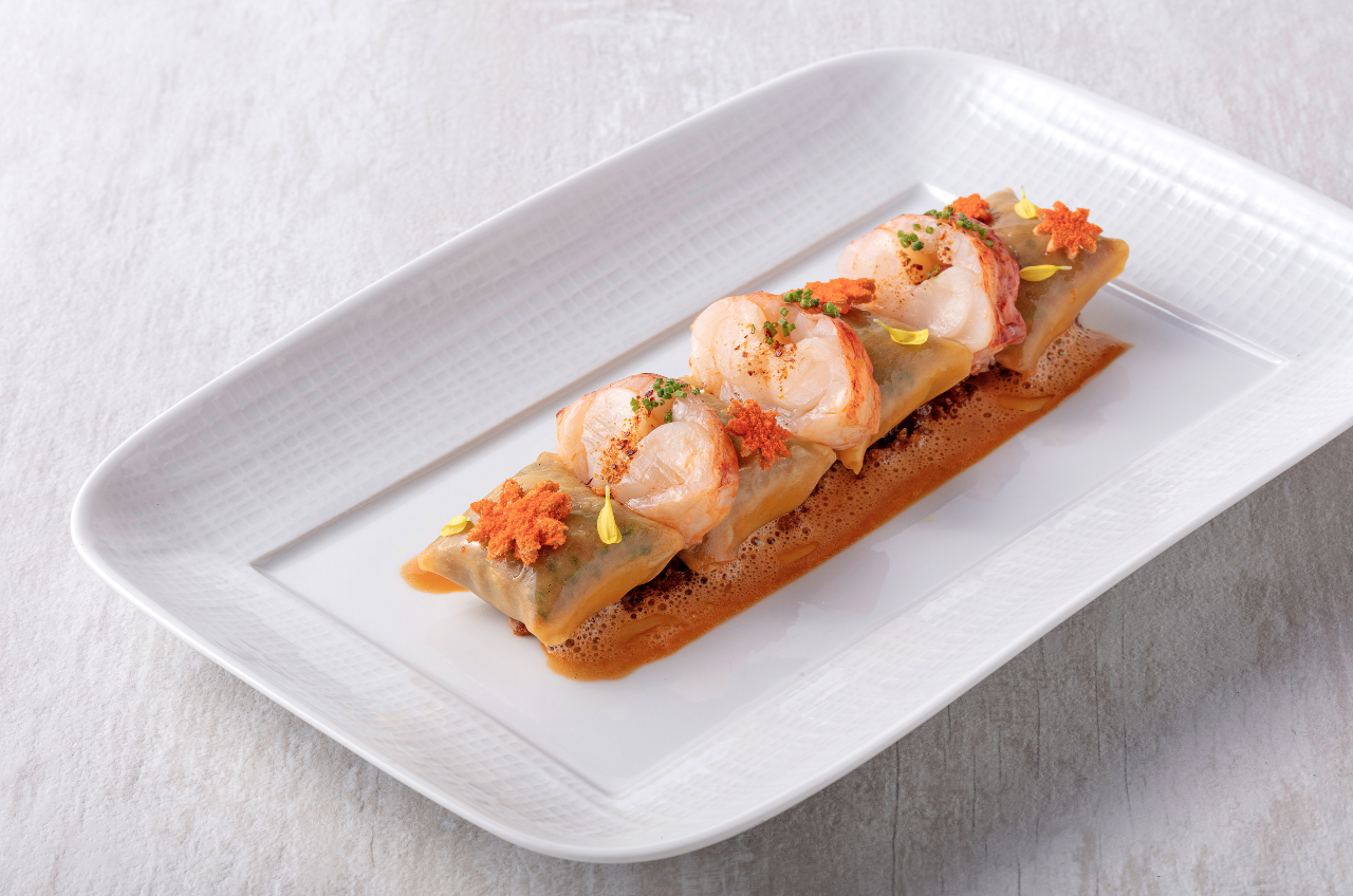 Plié de homard, chou du Pays, sauce Américaine.png
