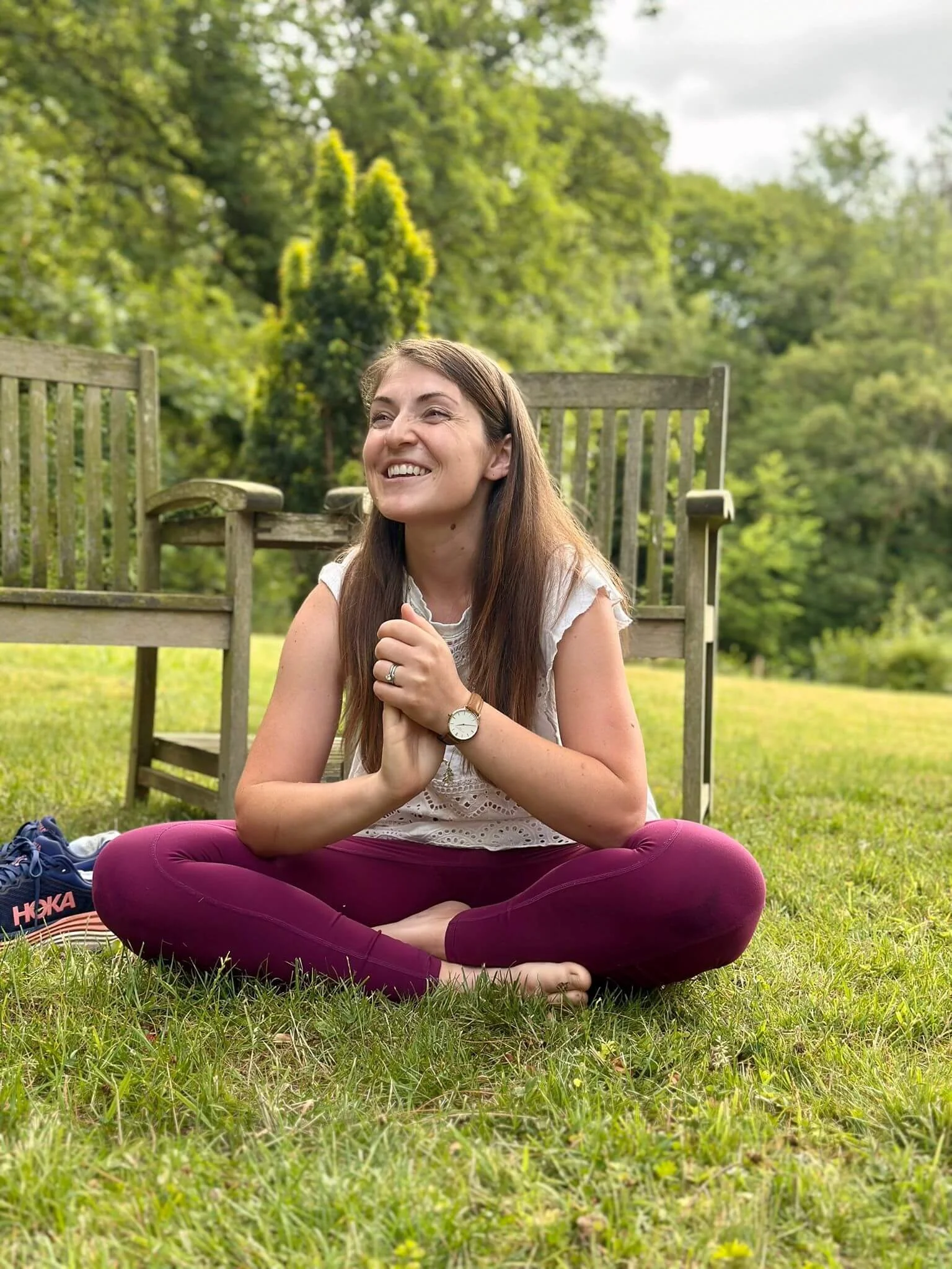 Katie Newman clapping hands together and smiling