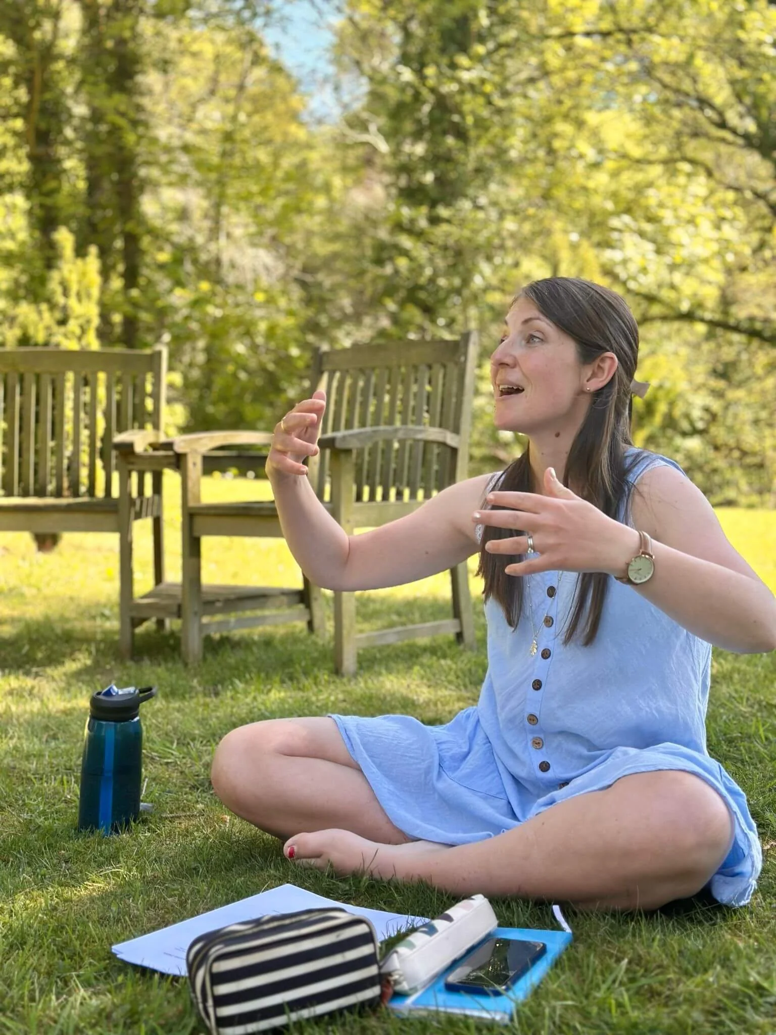 Katie Newman in a blue dress explaining how our minds work