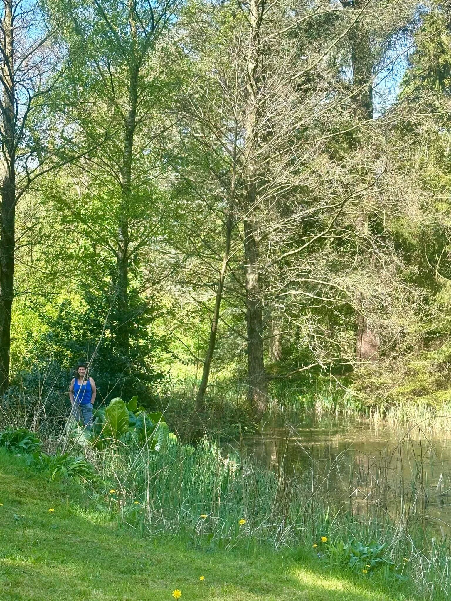 Lucy Atkinson stood by a pond