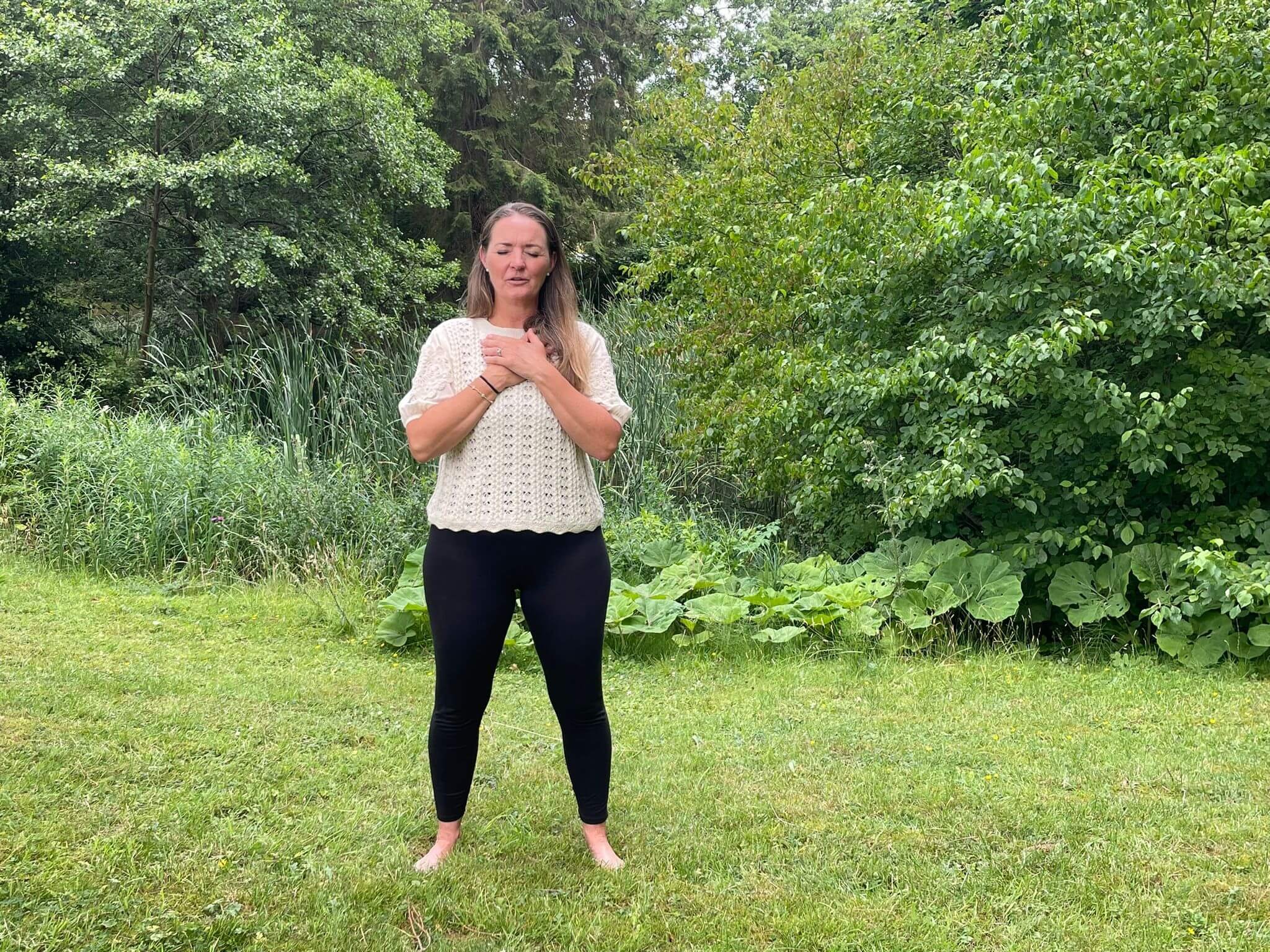 Sarah White stood barefoot with her hands on her heart