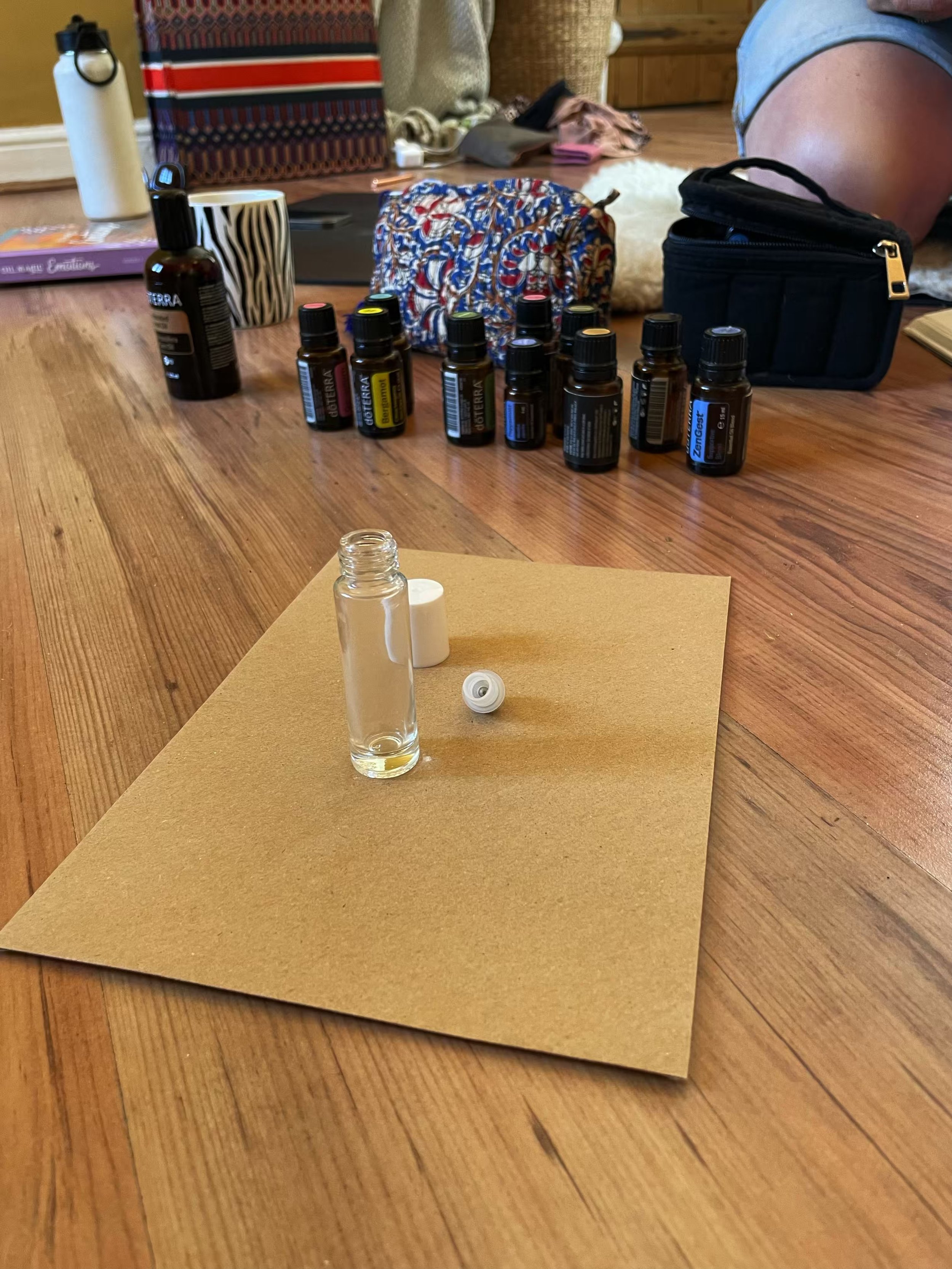 An empty essential oil roller ready on a brown encelope