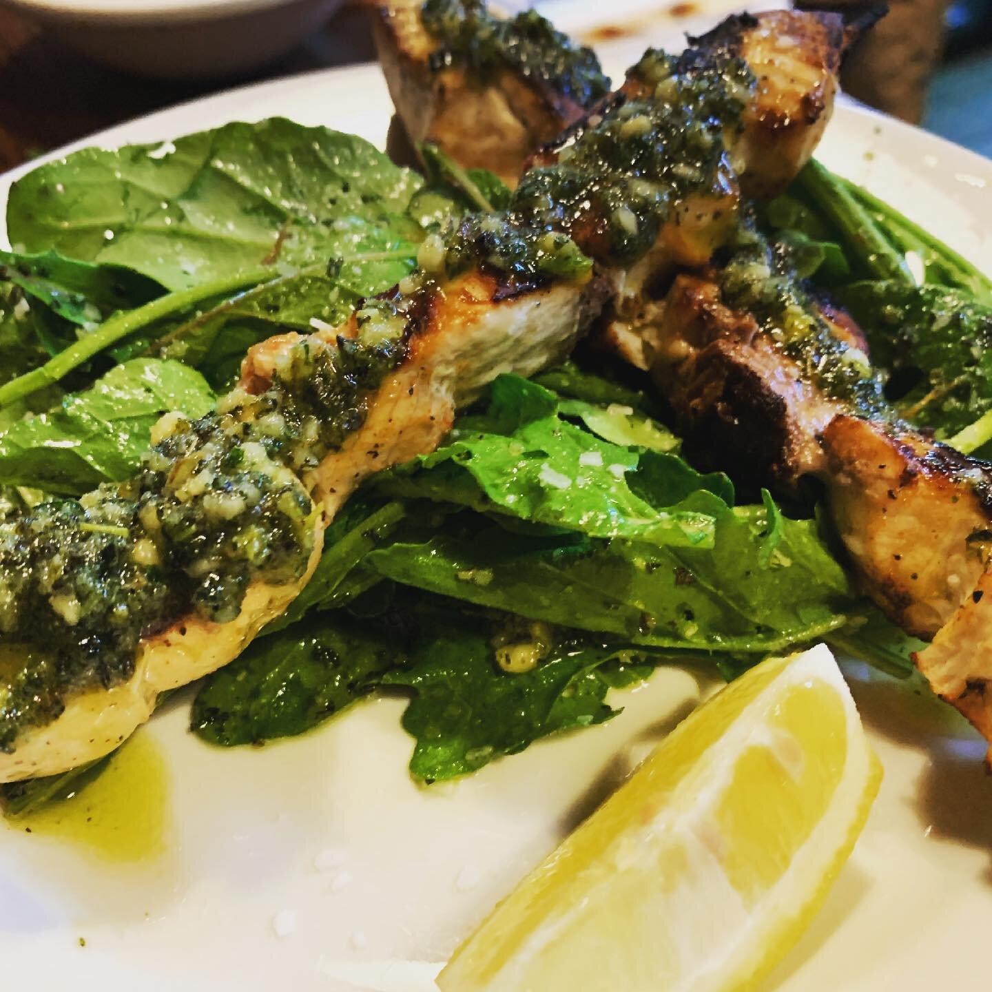 Skewered swordfish w fresh oregano &amp; almond picada over Verrill Farm arugula. Did you know our bar is back open for business? #fishoftheday #freshfish #pezespada #arugula #verrillfarm #localbusiness #localvegetables #localproduce #barisopen #seat