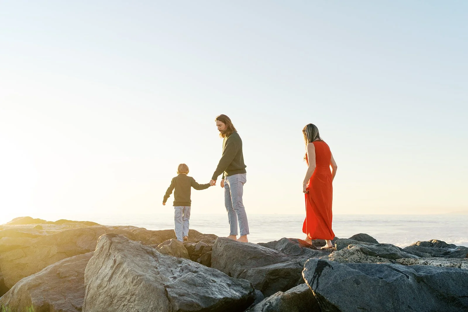Coastal family photography session captured at sunset in Southern California.