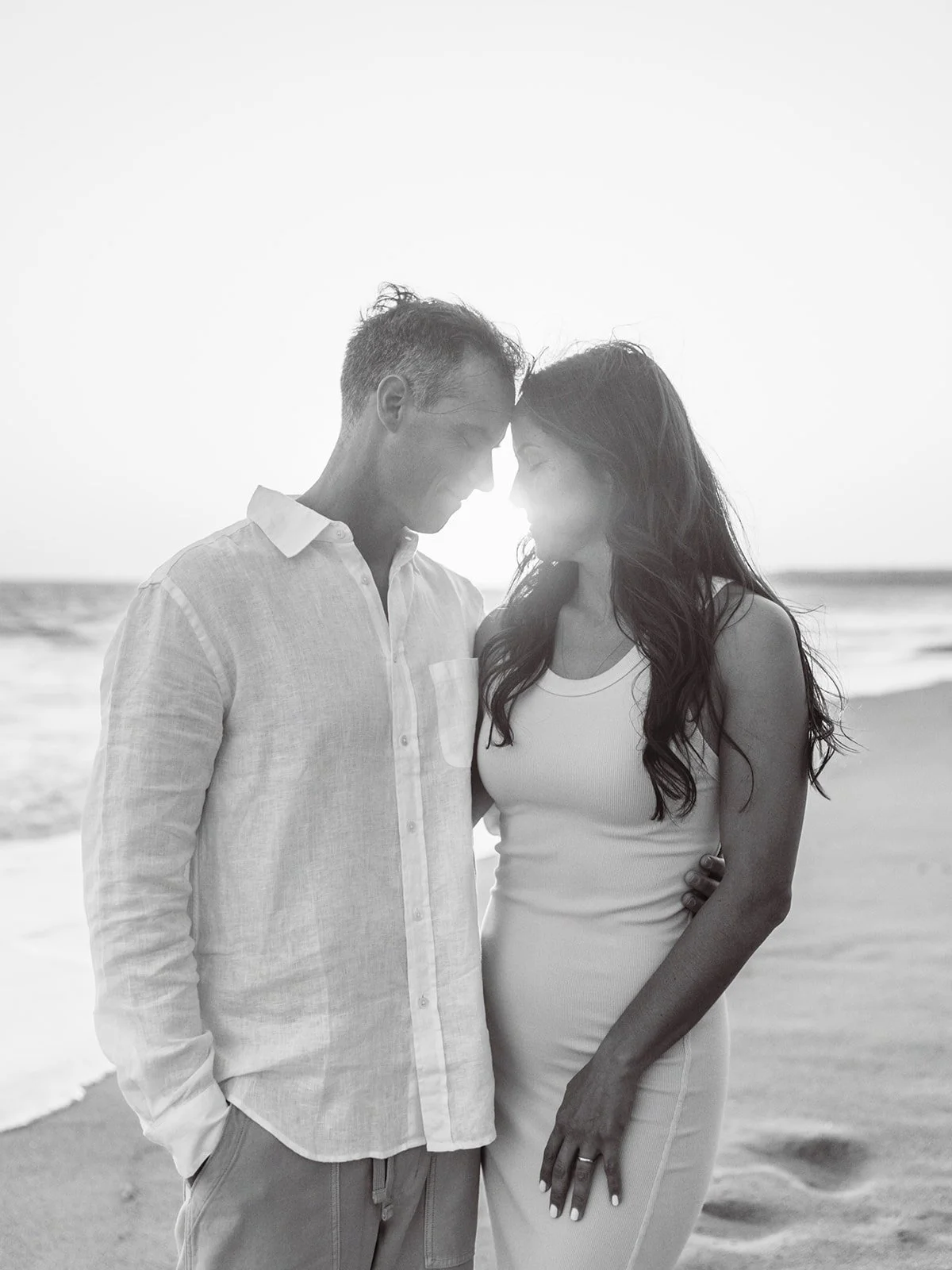 Editorial-inspired couple portrait captured during a sunset beach session in Southern California.