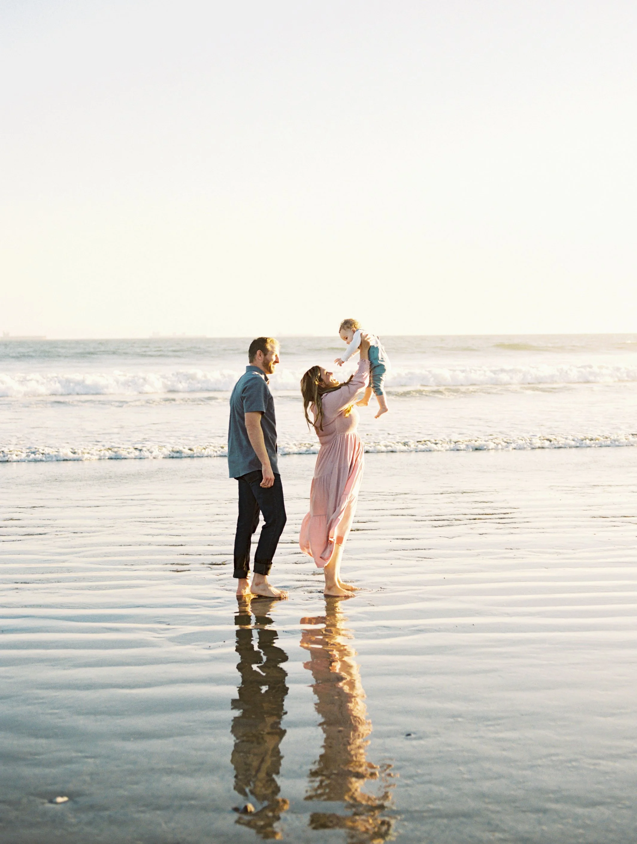 Coastal family portrait captured along the shoreline in Southern California.
